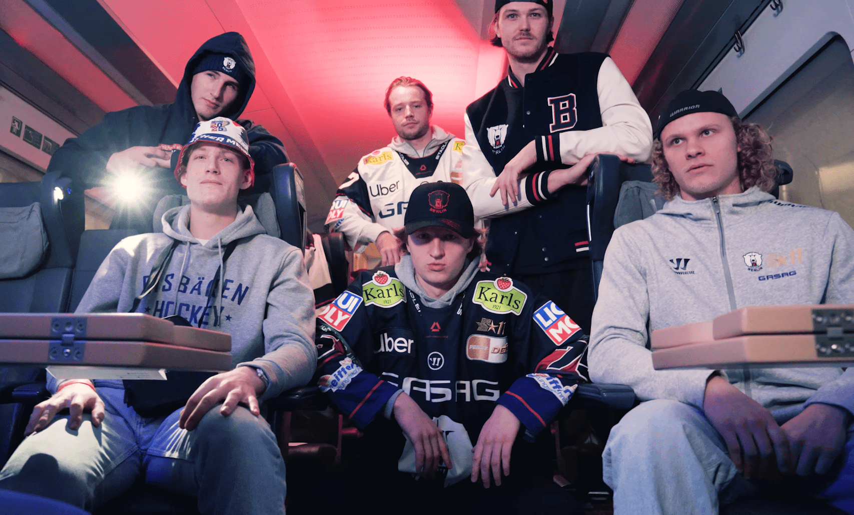 6 eisbaeren berlin ice hockey players looking into camera for the deutsche bahn music video