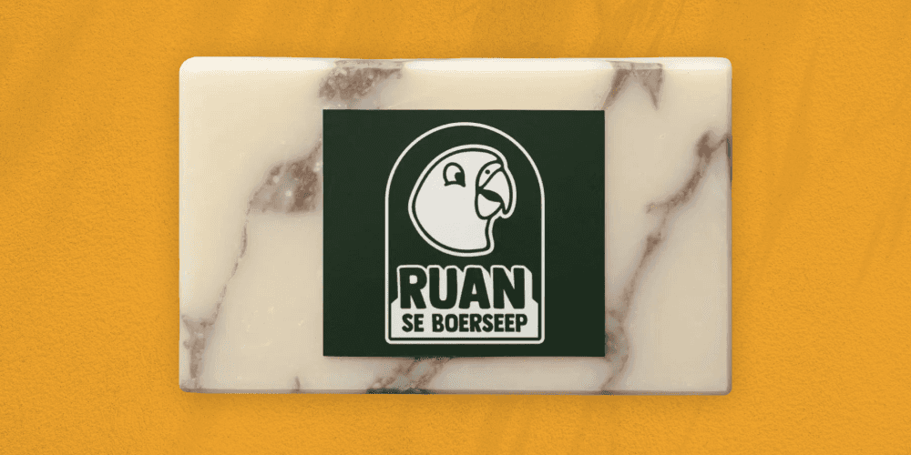 A soap with a card that has the logo on it.