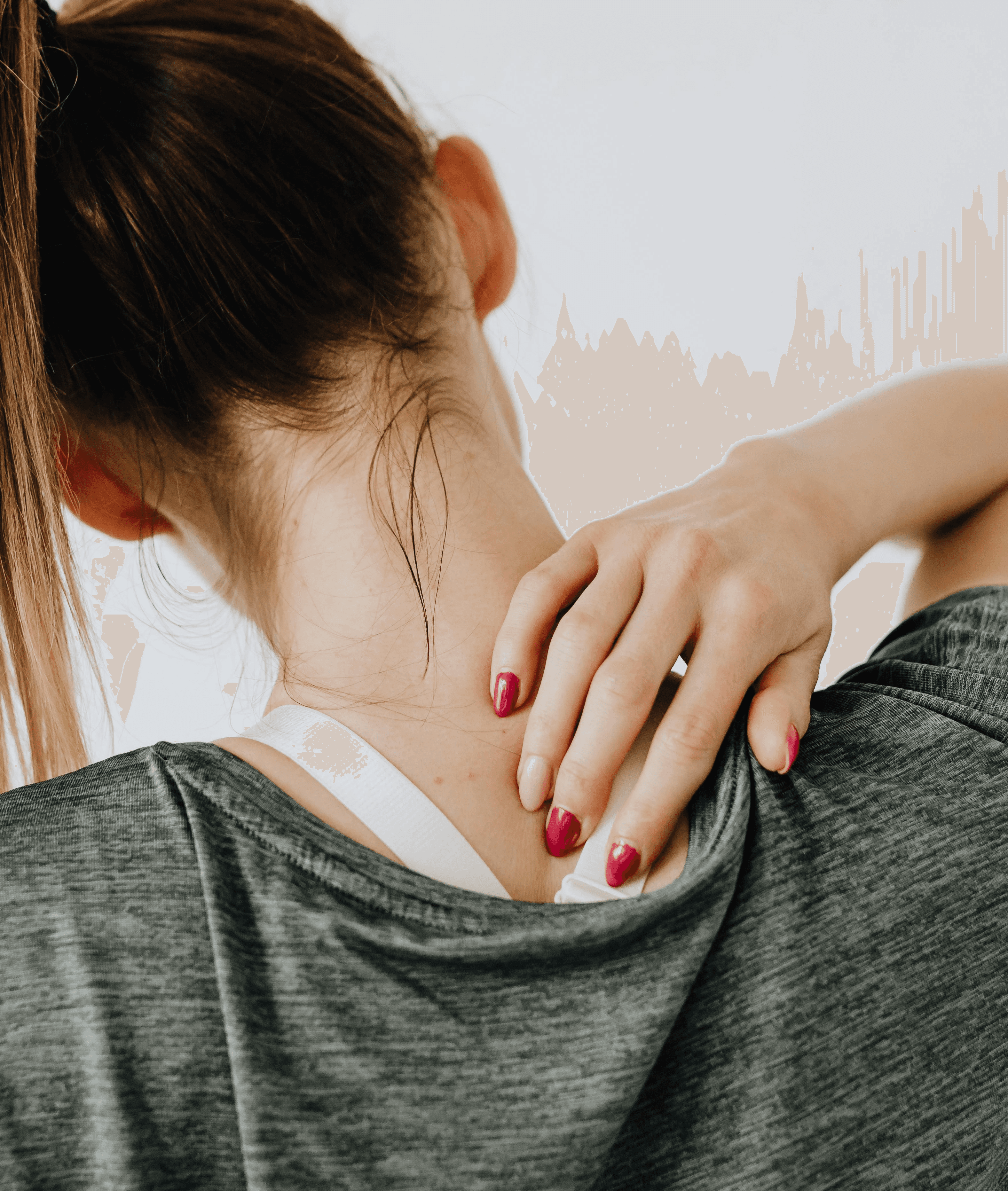A woman holding her neck in pain