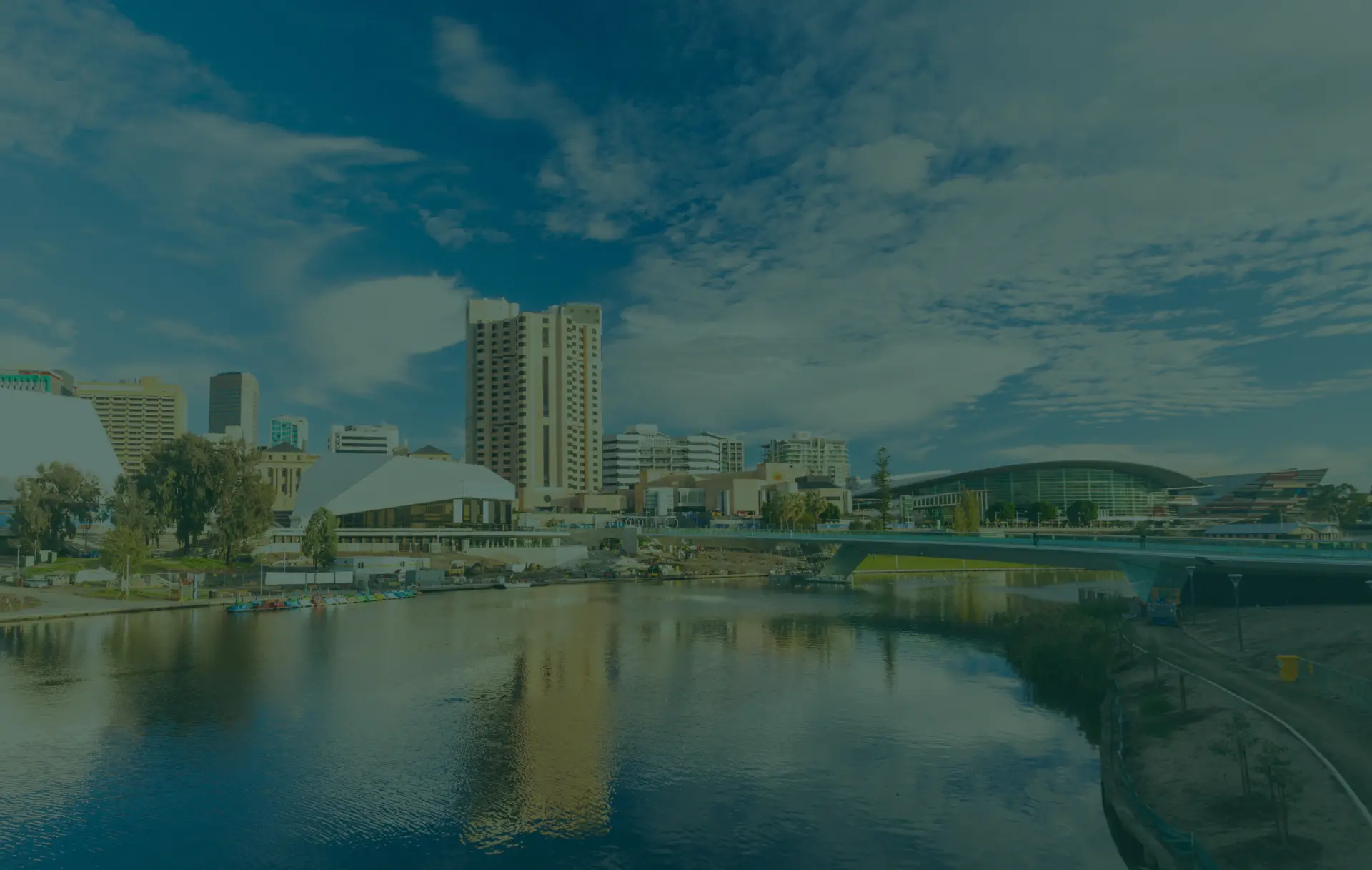 City skyline with river and bridge.