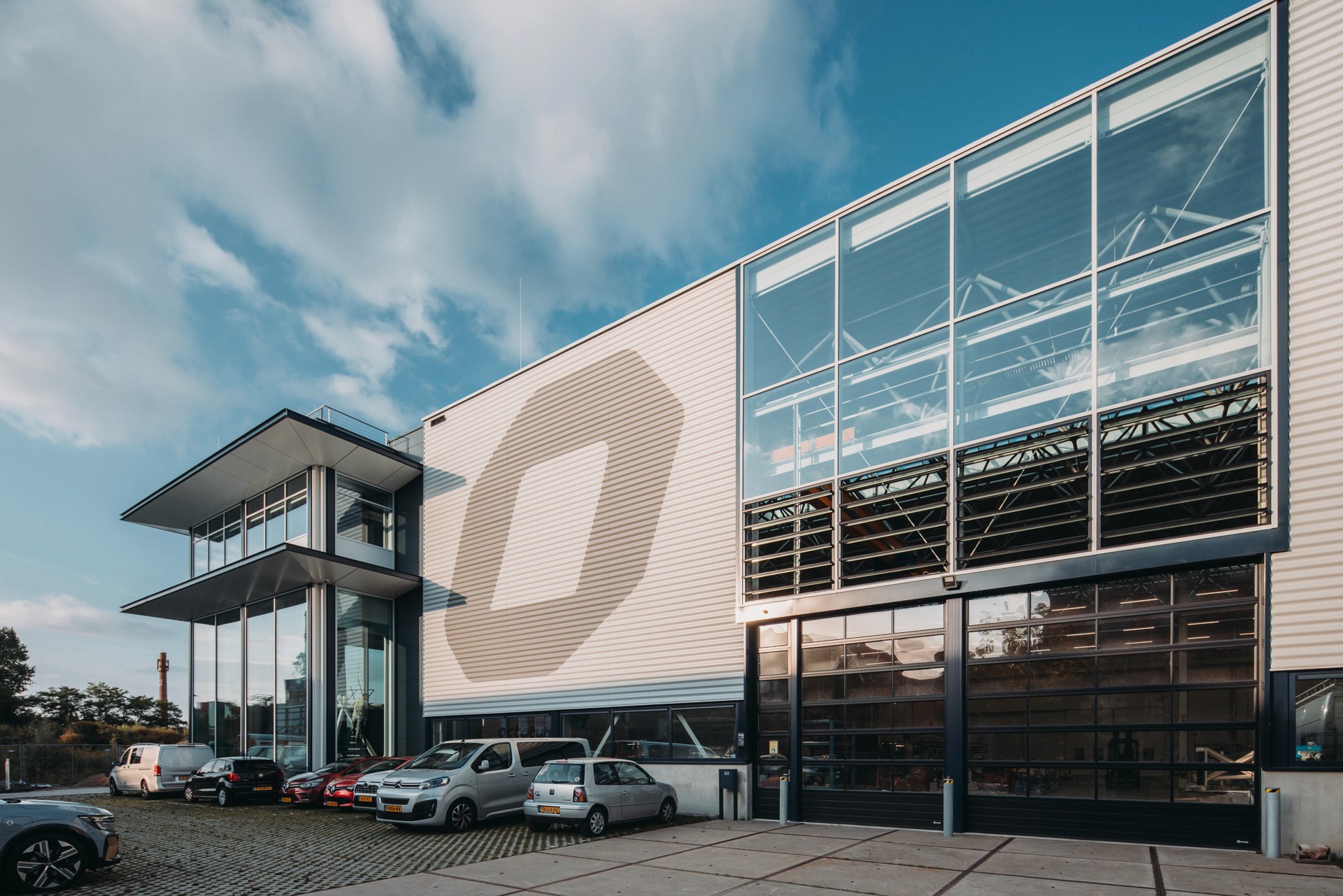 Photo of front and corner facade of the new Octatube headquarters in Delft
