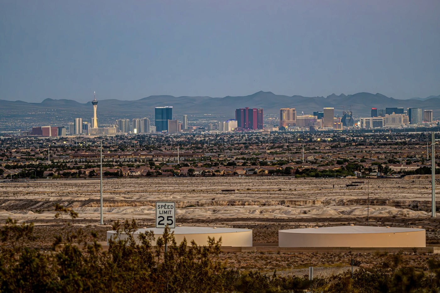 Las Vegas skyline over a desert landscape with distant mountains