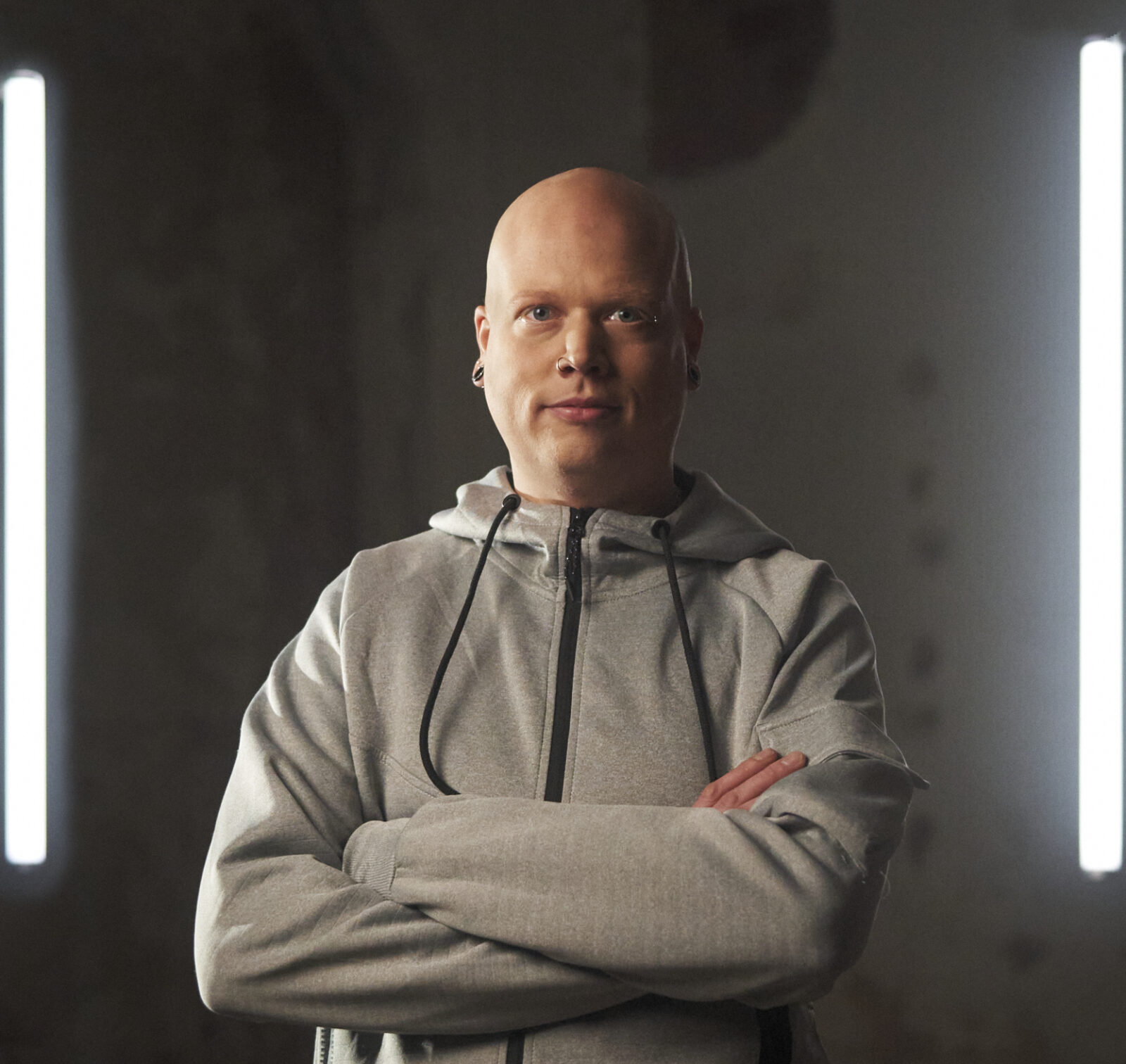 The image captures the ethereal beauty of an underwater cave illuminated by sunbeams penetrating through an opening above.