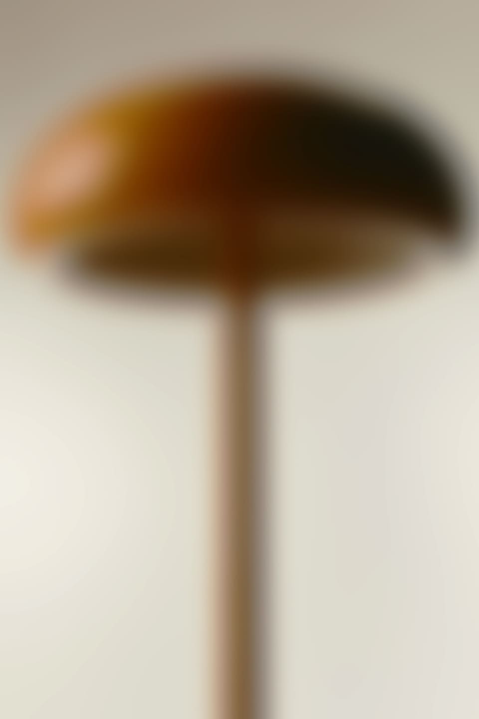A blurry photo of an orange lamp.