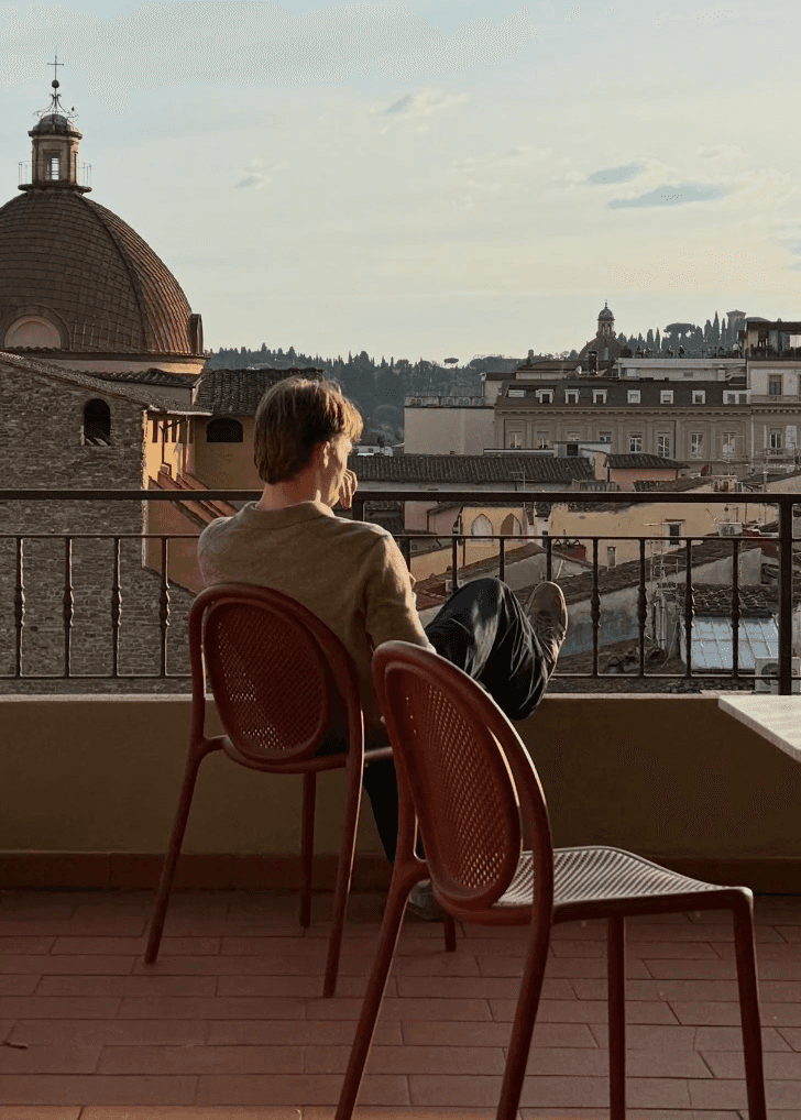 a blurry photo of a person standing in front of a wall