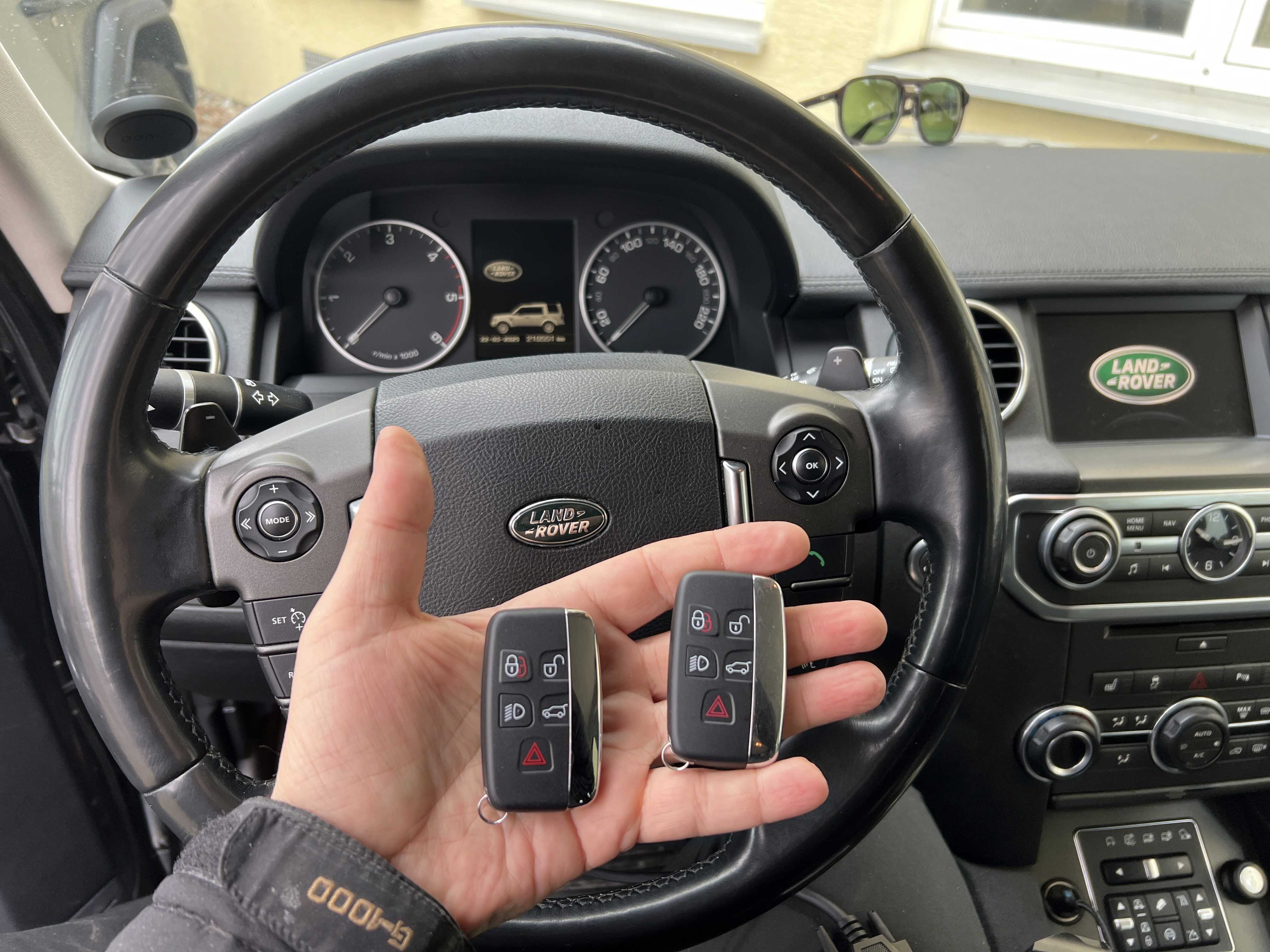 a person swimming in the water with grass