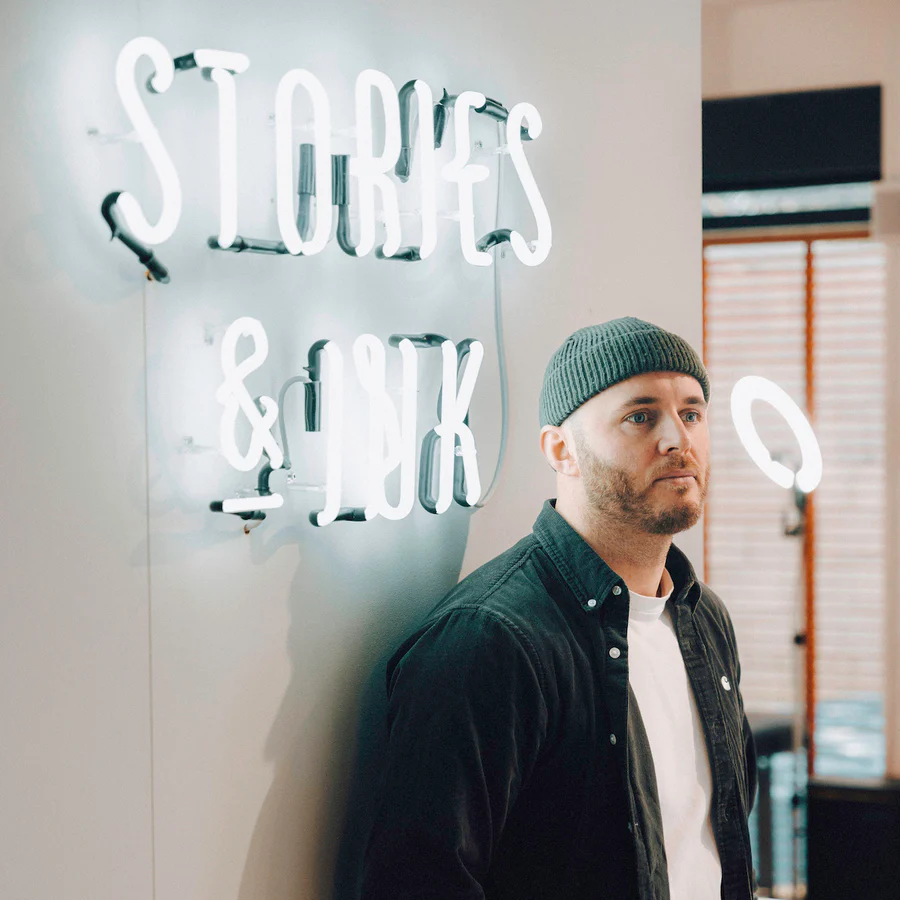 Creative professional in tattoo studio representing Stories and Ink custom design services