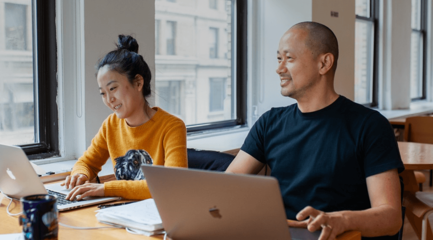A small design team collaborating around a shared workspace, ideas in motion.