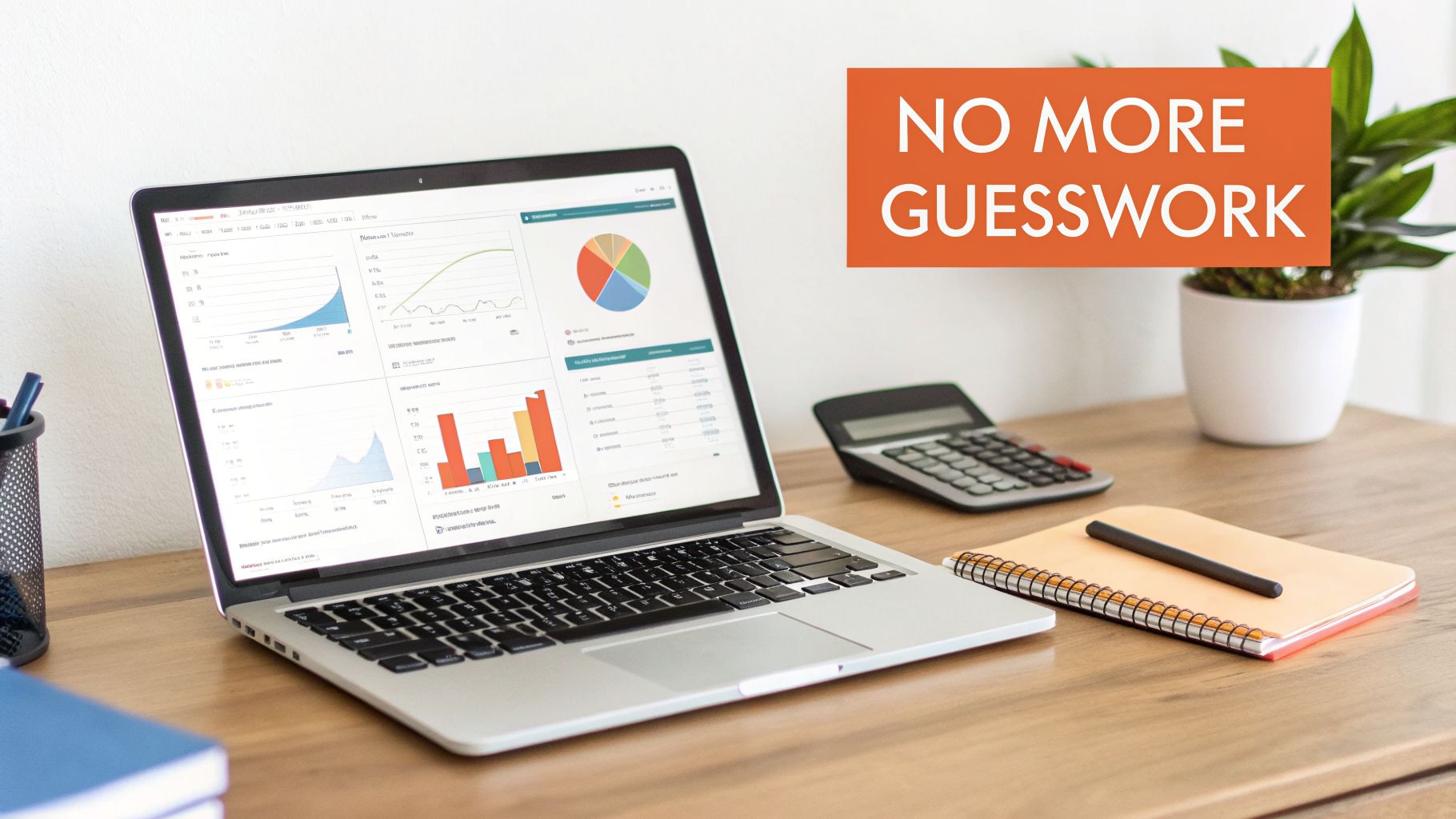 A laptop displaying data analysis charts and graphs, a calculator, and a notebook on a wooden desk.