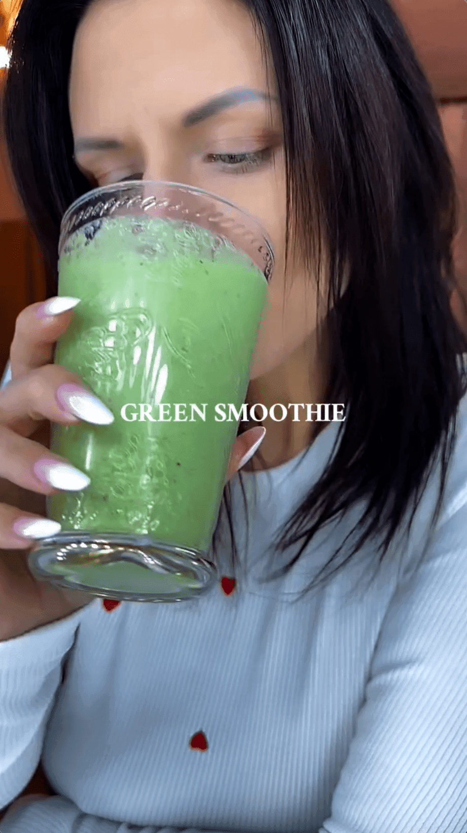 Influencer my_moments_life.89 drinking a green smoothie made using Nutribullet Portable Blender