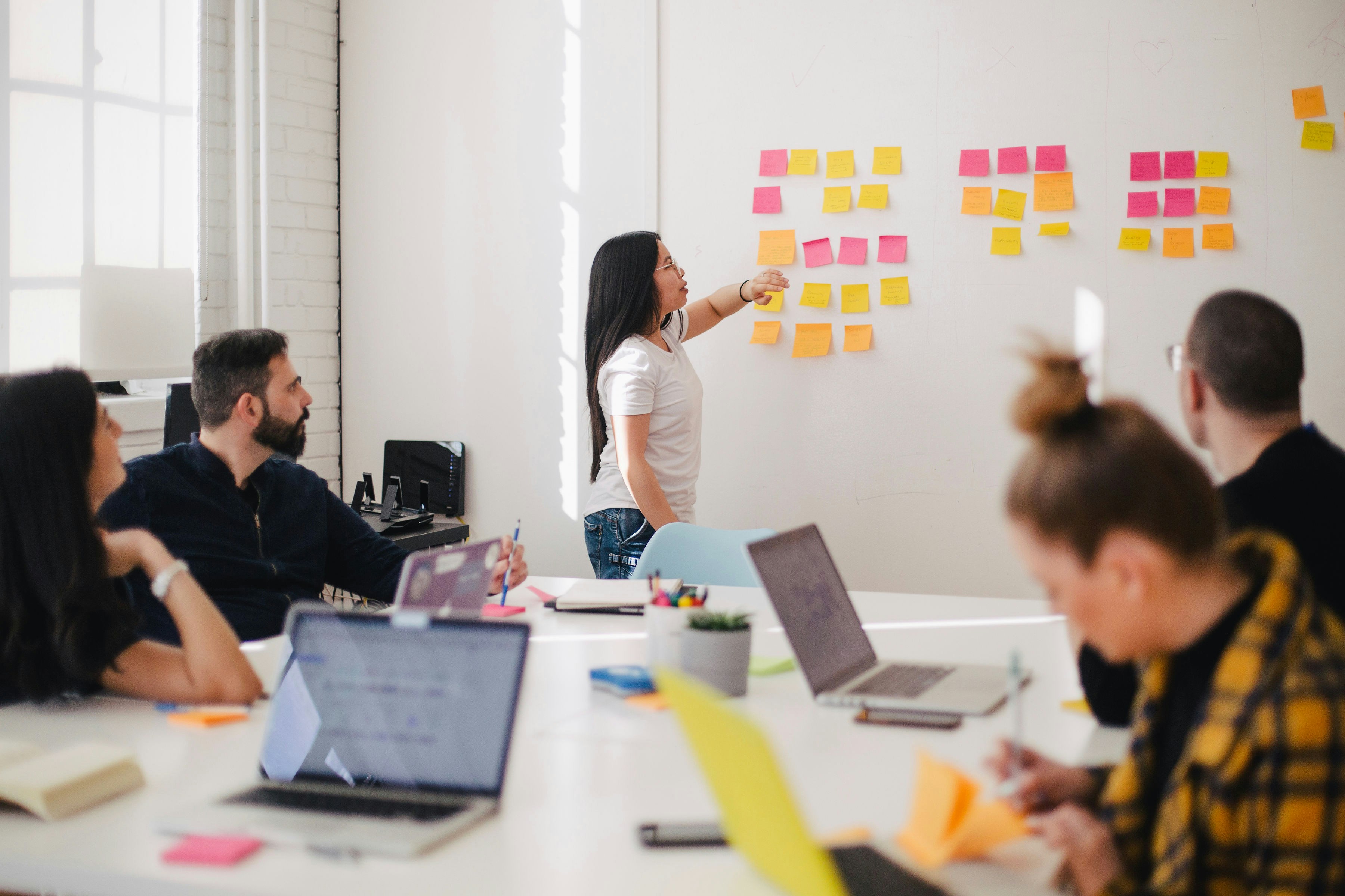 woman in the meeting room - Sales Funnel Stages