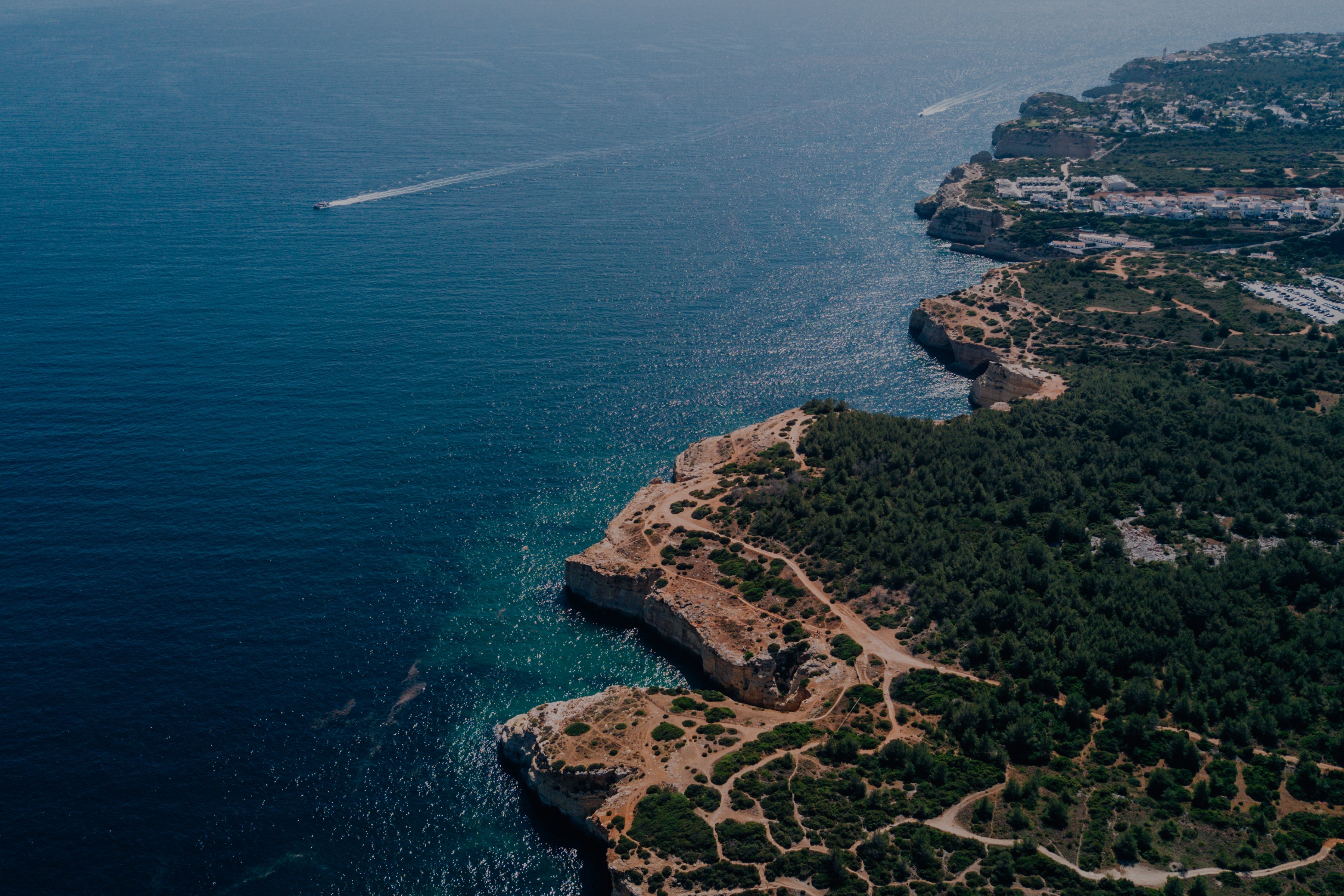 Panoramic view of a mountain landscape with clouds and rocky peaks