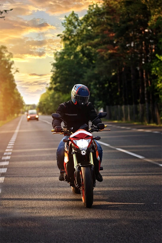 Motorcyclist riding at dusk, representing serious crash injuries handled by Stockton motorcycle accident lawyers