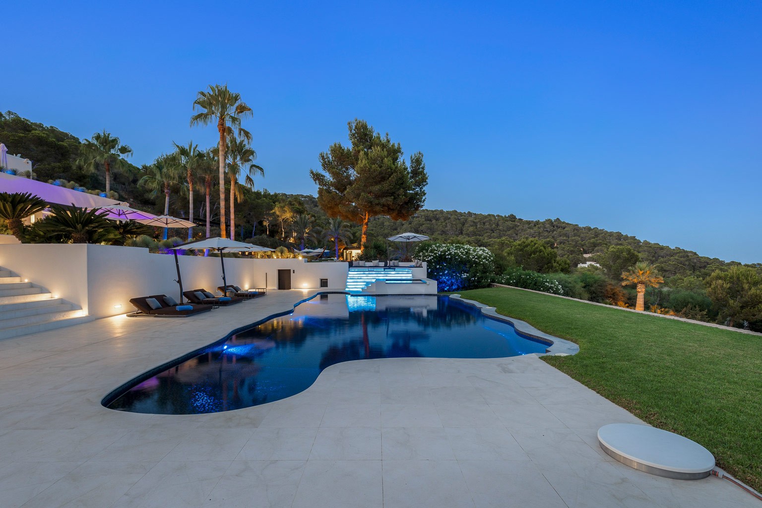 Nighttime pool view at the exclusive luxury villa in Ibiza—privacy-focused VIP estate property holiday retreat for weddings and events.