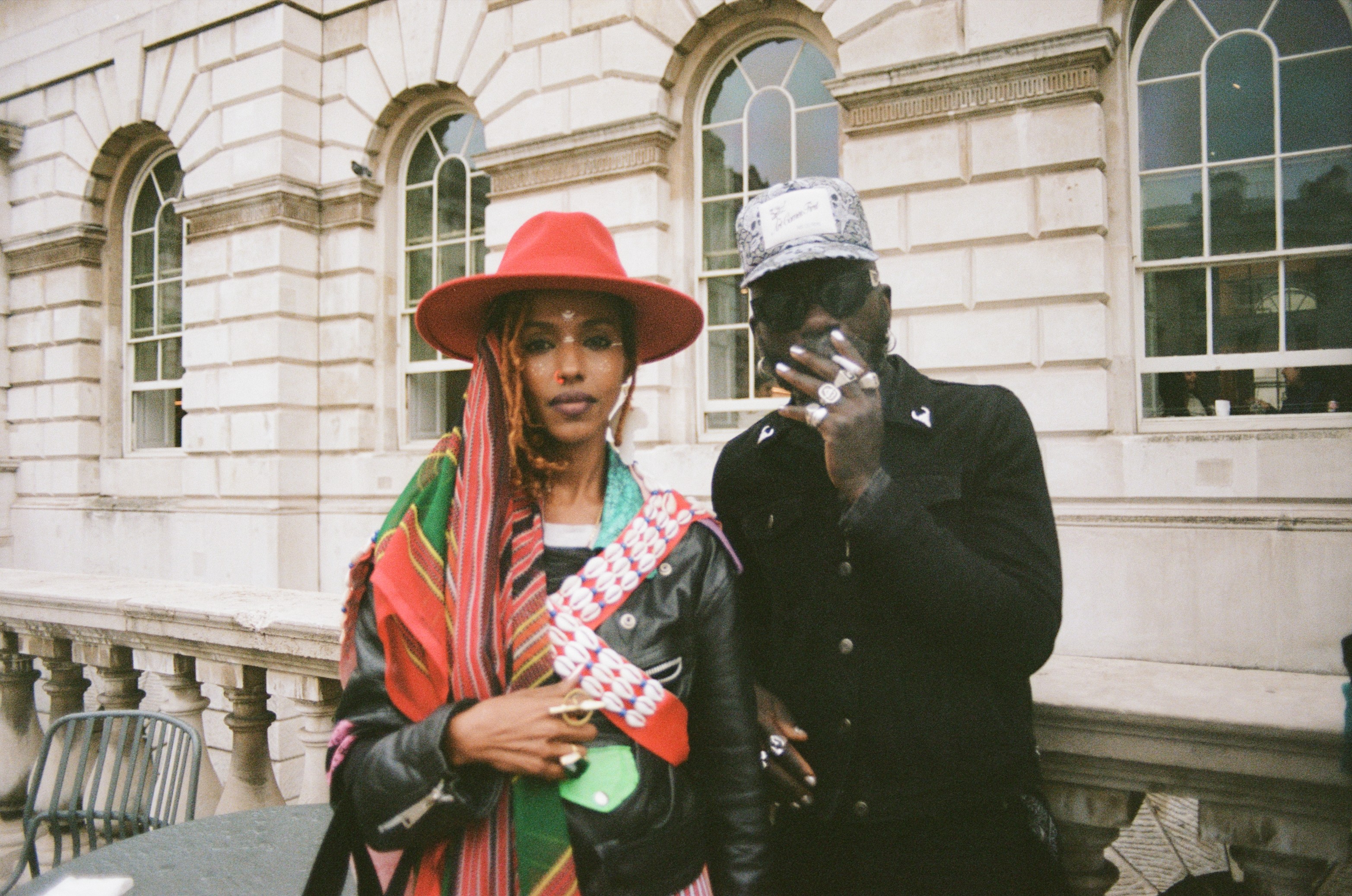 Modern skyscrapers line a busy highway in a sprawling city.