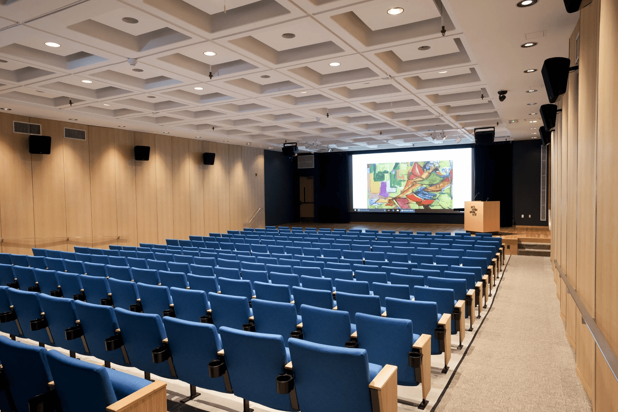 people sitting on chairs watching a game