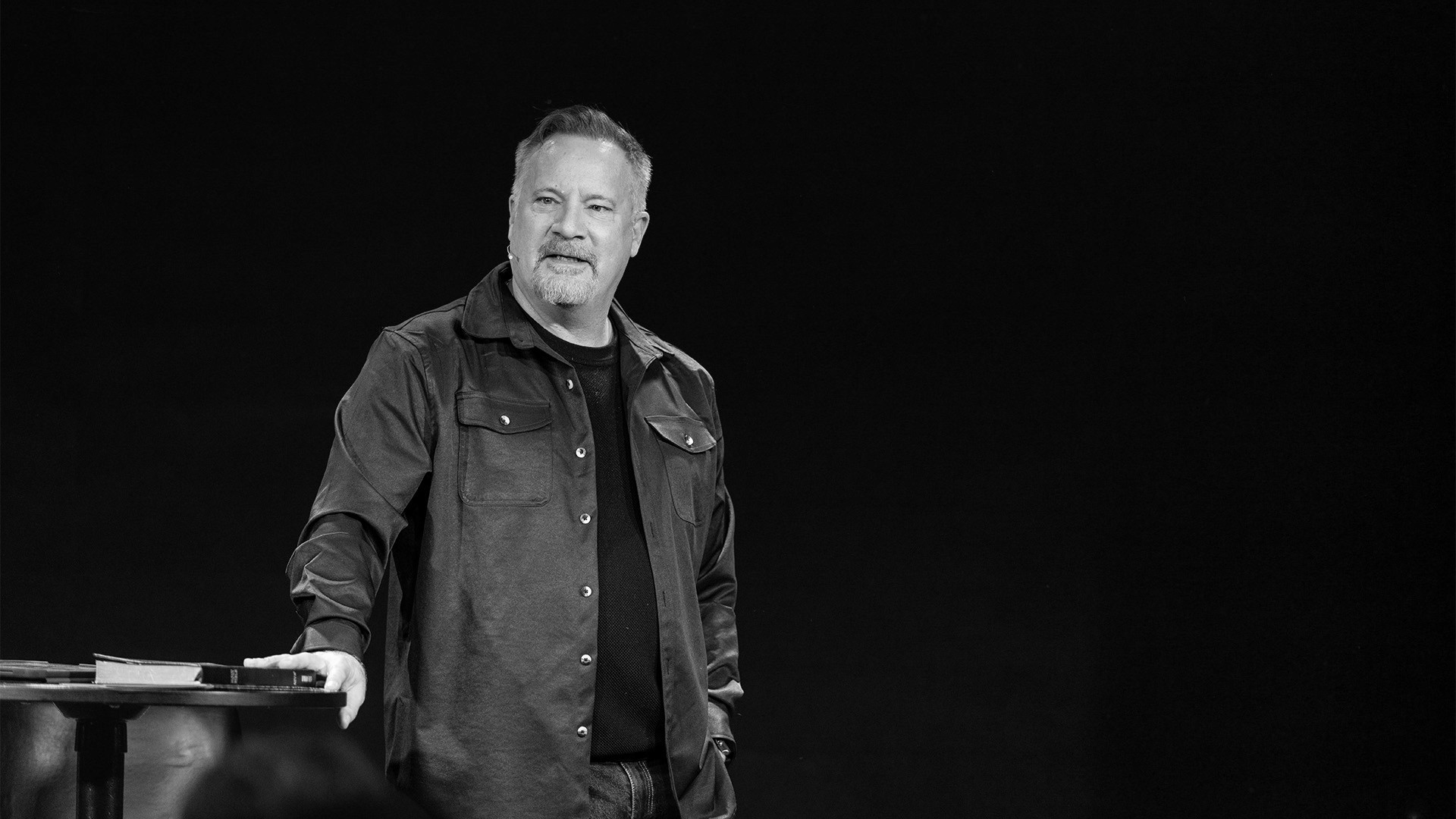 two people looking at a tablet and smiling