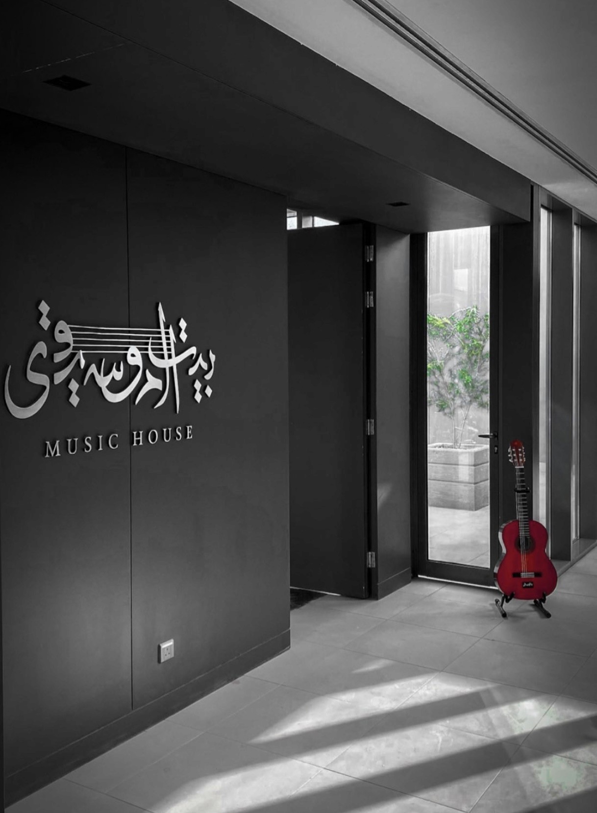 Person in a white off-shoulder top using a MacBook laptop, with text overlay 'What's new in digital?' and the fabrica® logo in the top corner.