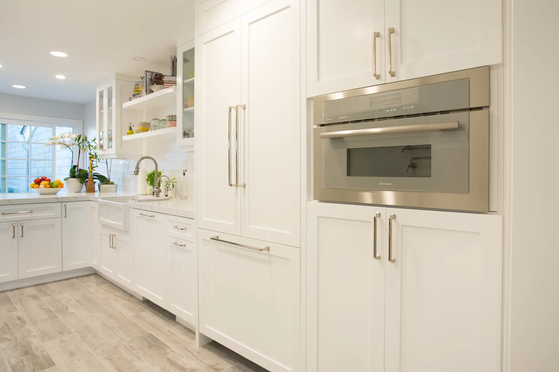 Modern white kitchen cabinetry wall with steam oven. From Dana Point Cape Cod remodel. Photo by Chris Darnall.