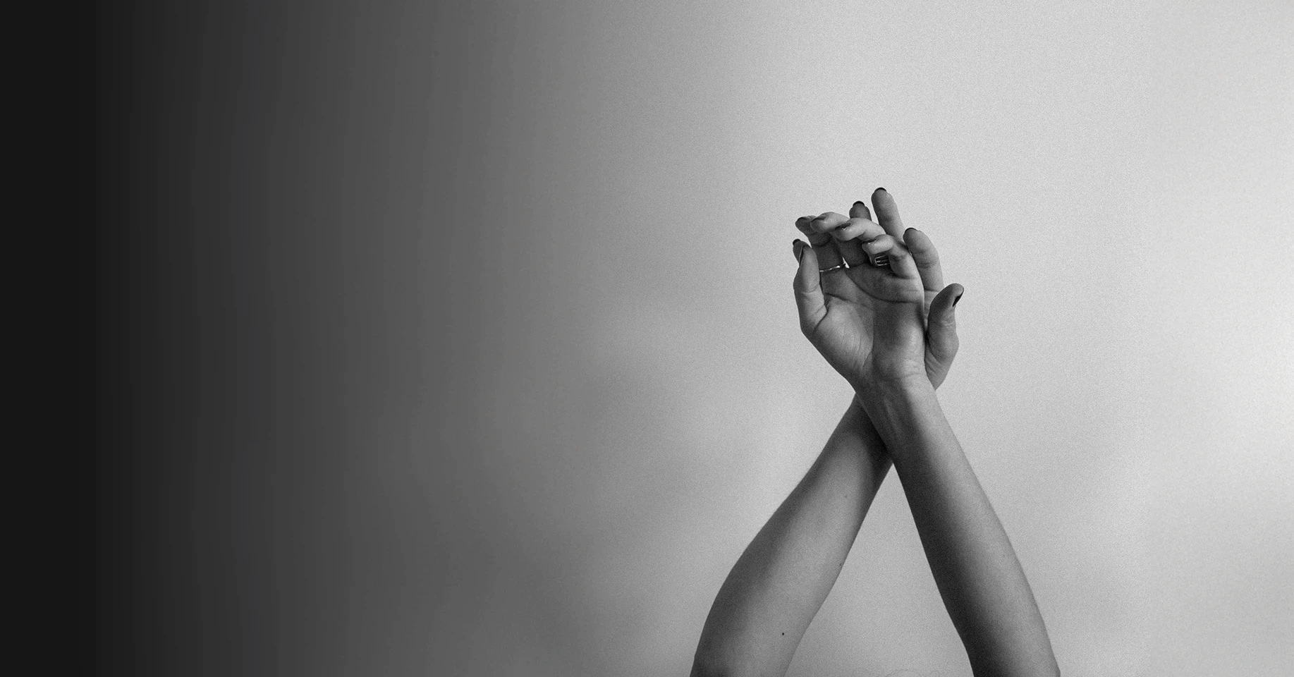 person raising both hands