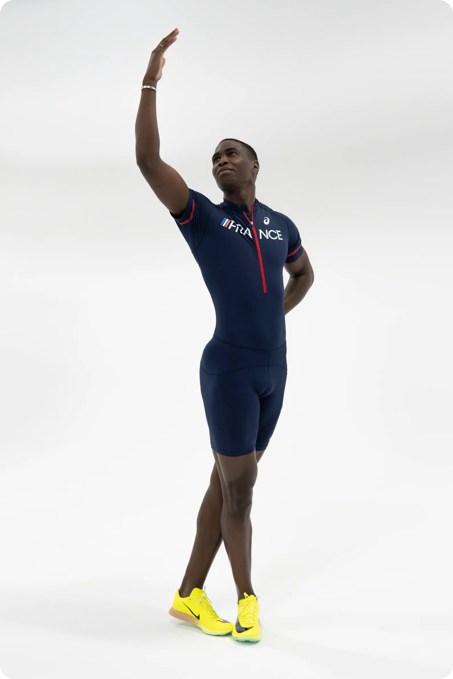 French athlete Harold Correa supported by SNCF, photographed in studio against a white background in a graphic and elegant pose.