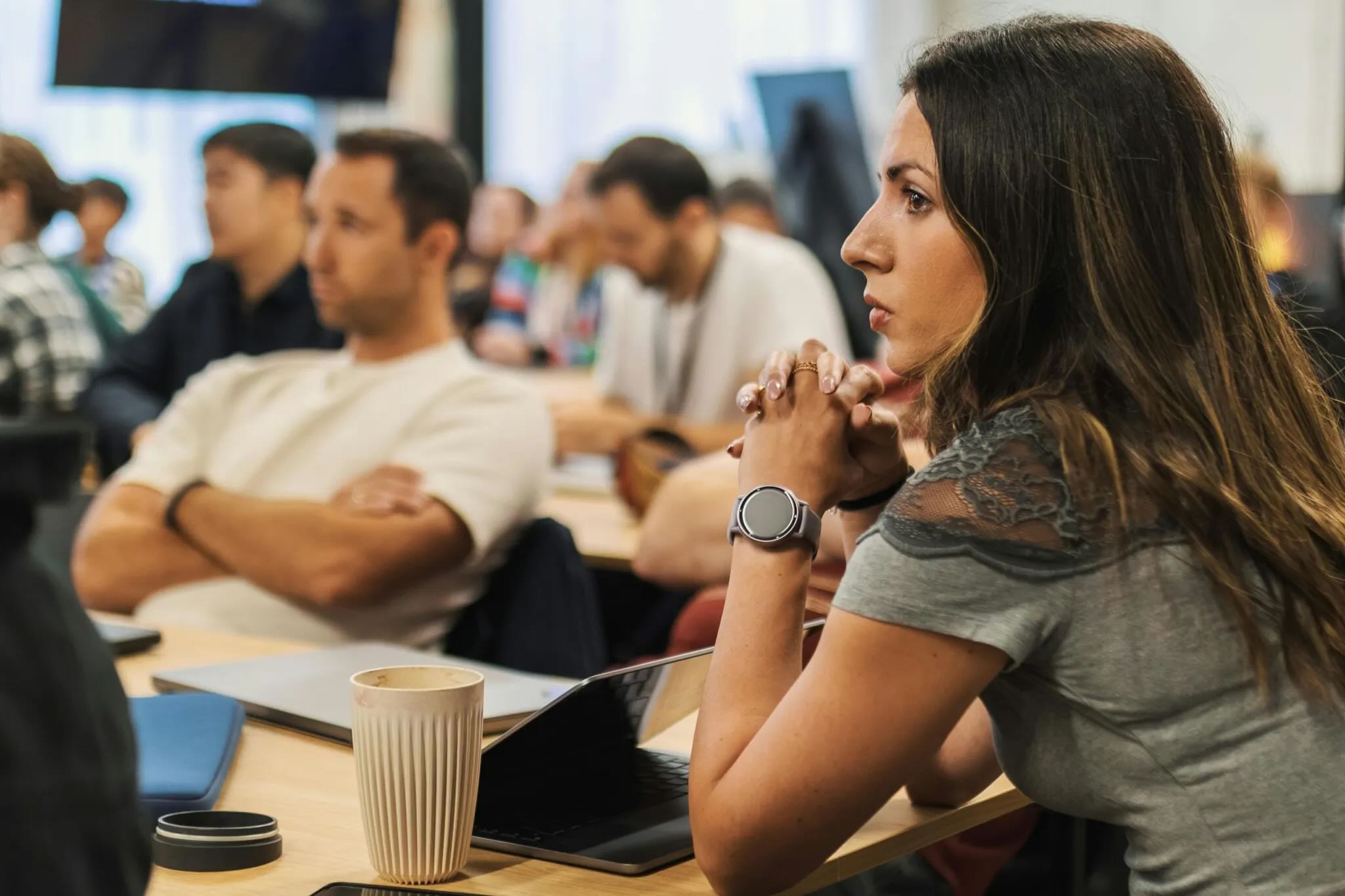 An employee sitting in a meeting