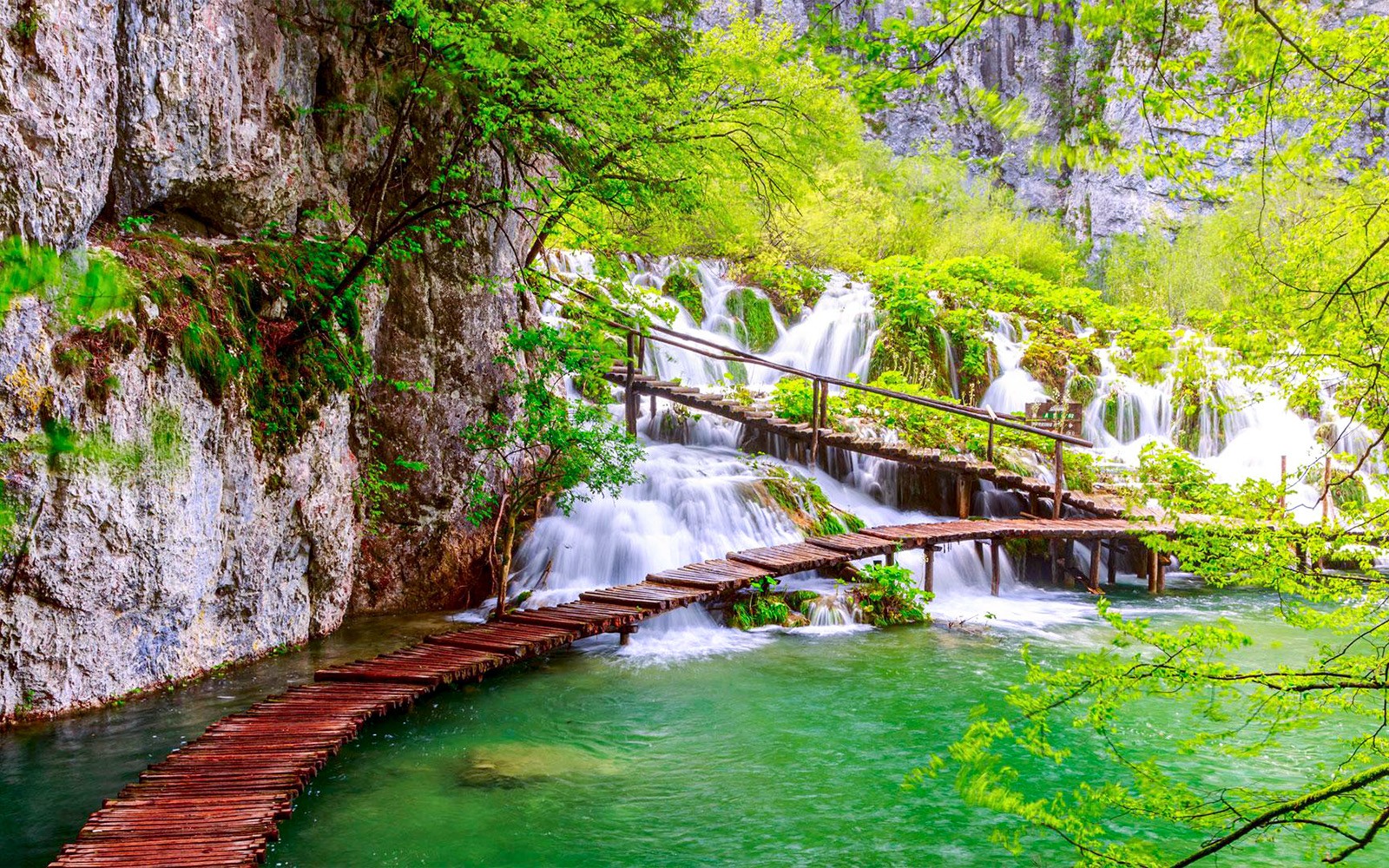 Wooden path over waterfalls at Plitvice Lakes National Park, Croatia.