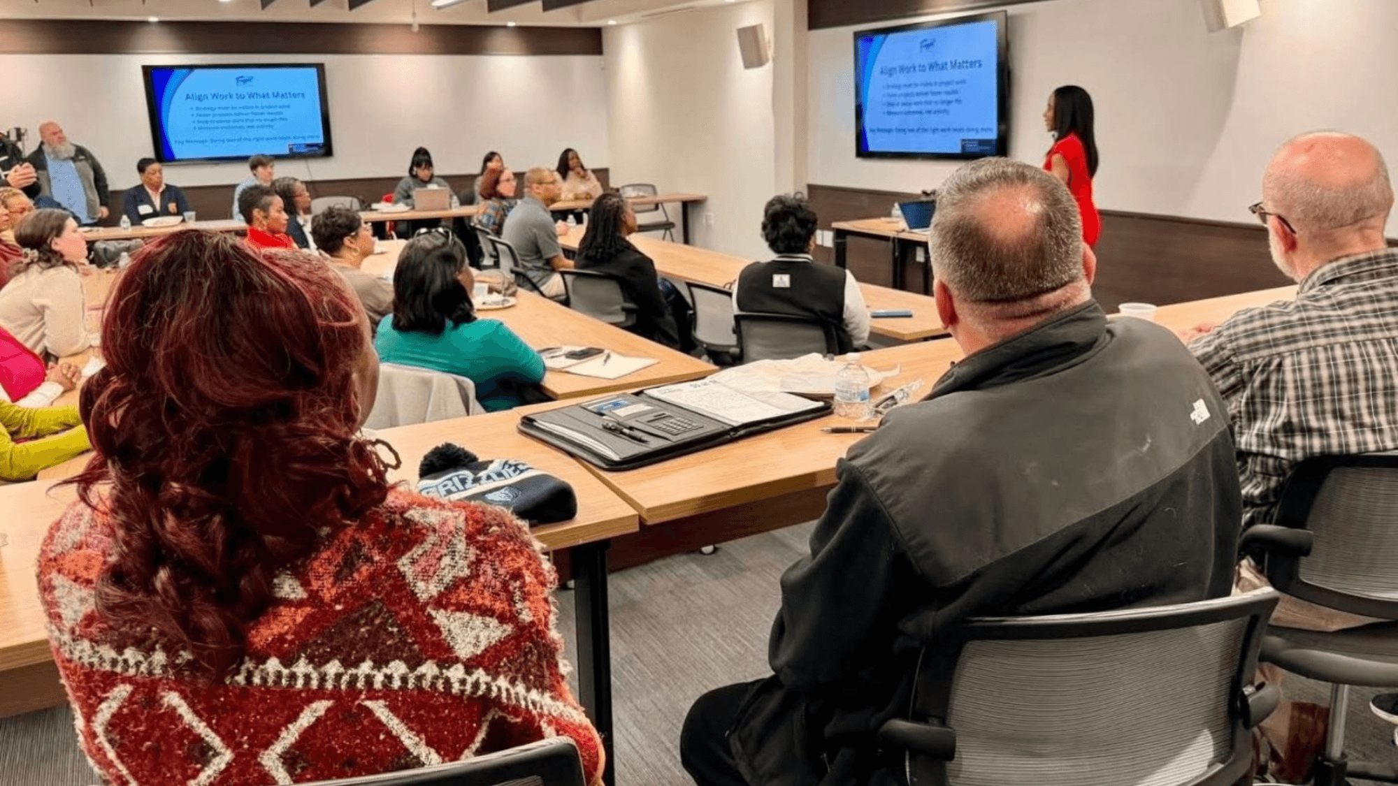 Interior of a cafe or workspace with several people at tables
