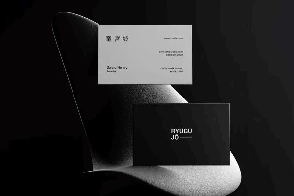 A sleek, modern business card design on a dark background with subtle shadow effects.
