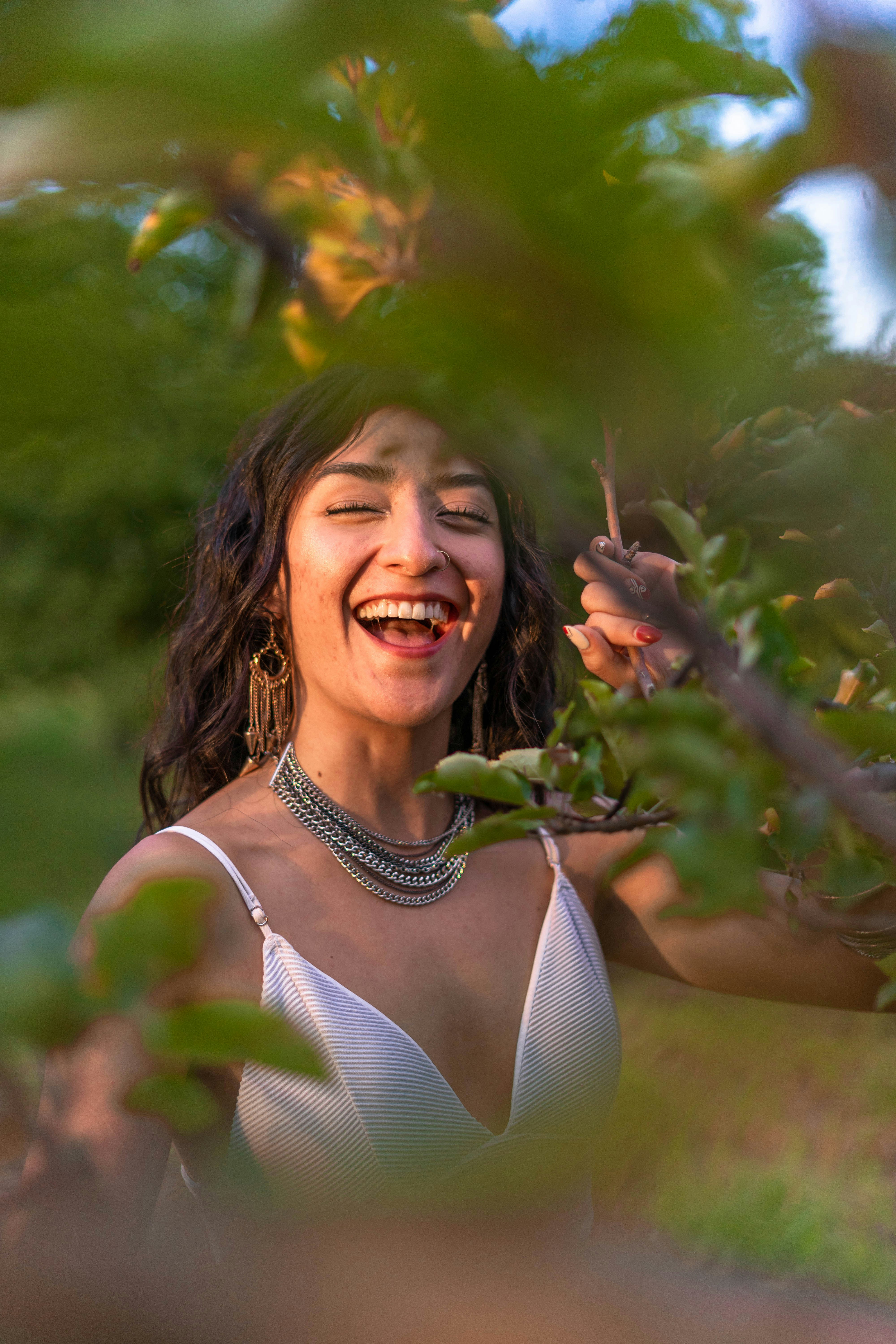 a woman in a white dress is smiling
