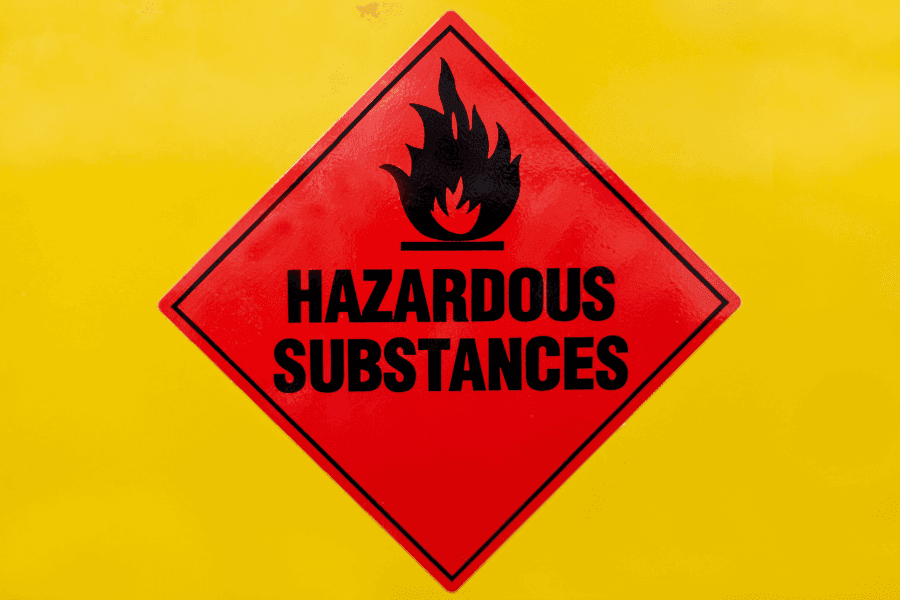 Red hazardous diamond sign indicating dangerous goods compliance.