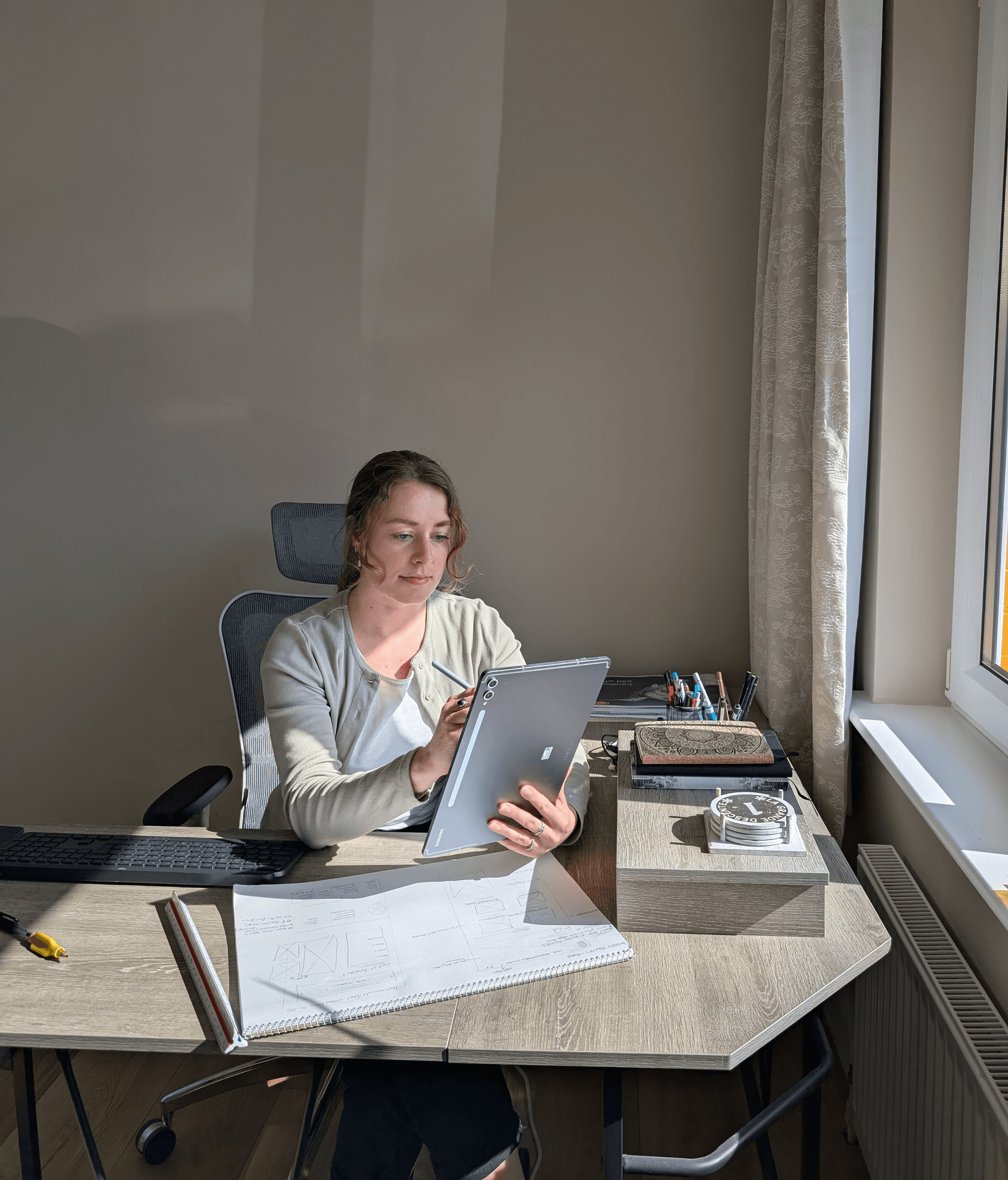 Peak Pixel Design founder Yosta at her desk in Kenmare, representing the technical expertise and systems automation behind 'The Automated Estate' website builds.