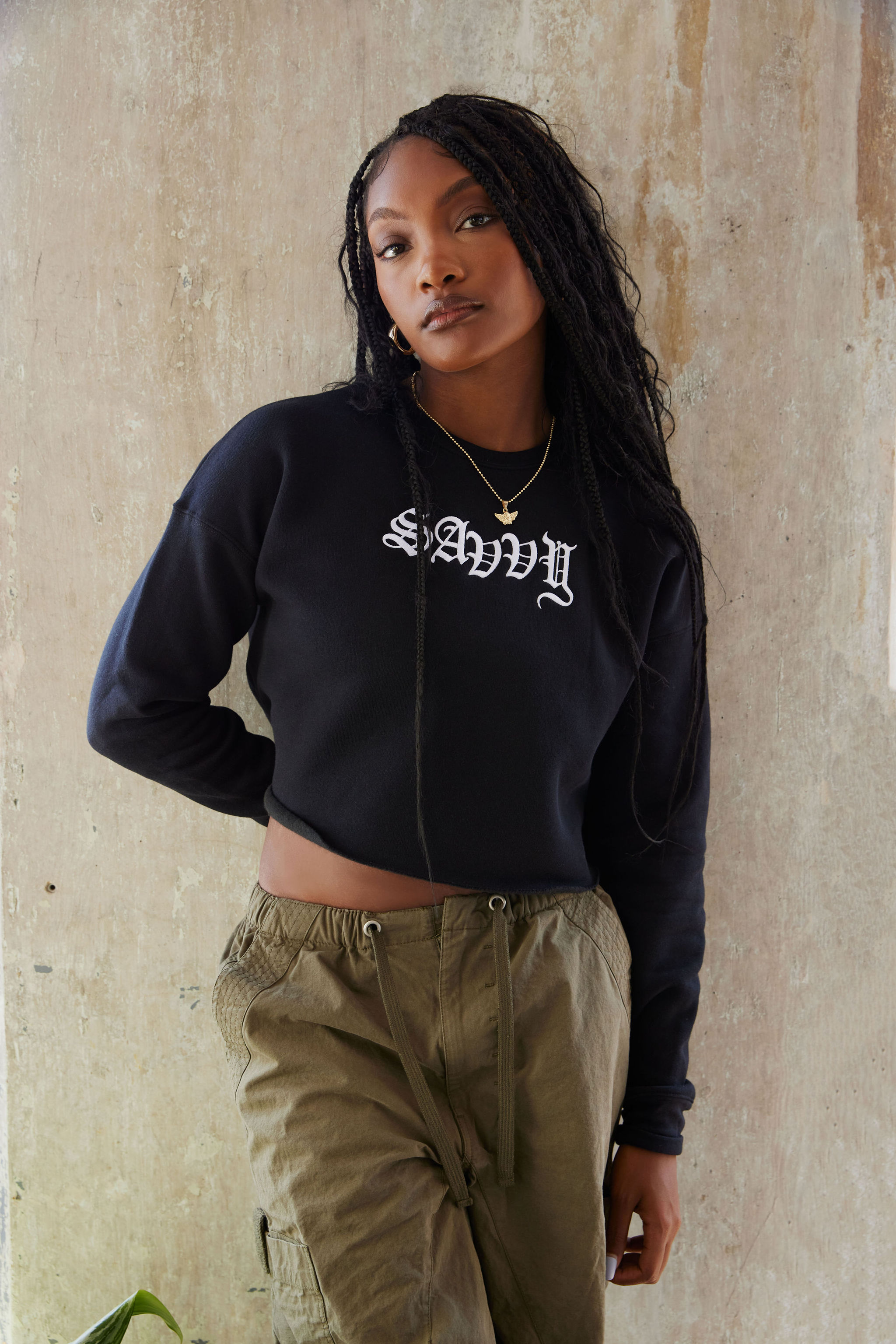 Woman walking on a curved pavement with shadow.