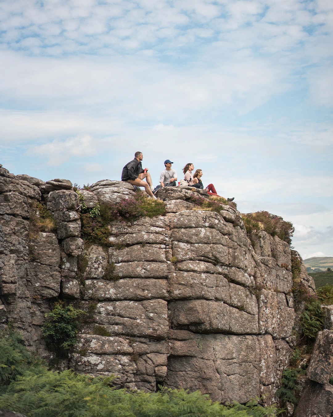 Streetside billboard with flyposters of the Batch.Works brand and illustrations
