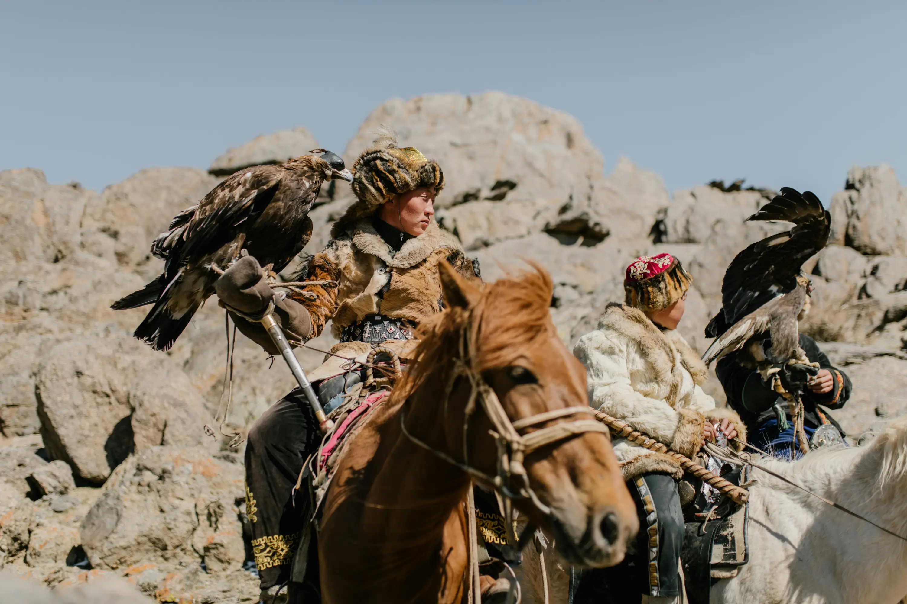 Mongolian eagle hunter on a horse