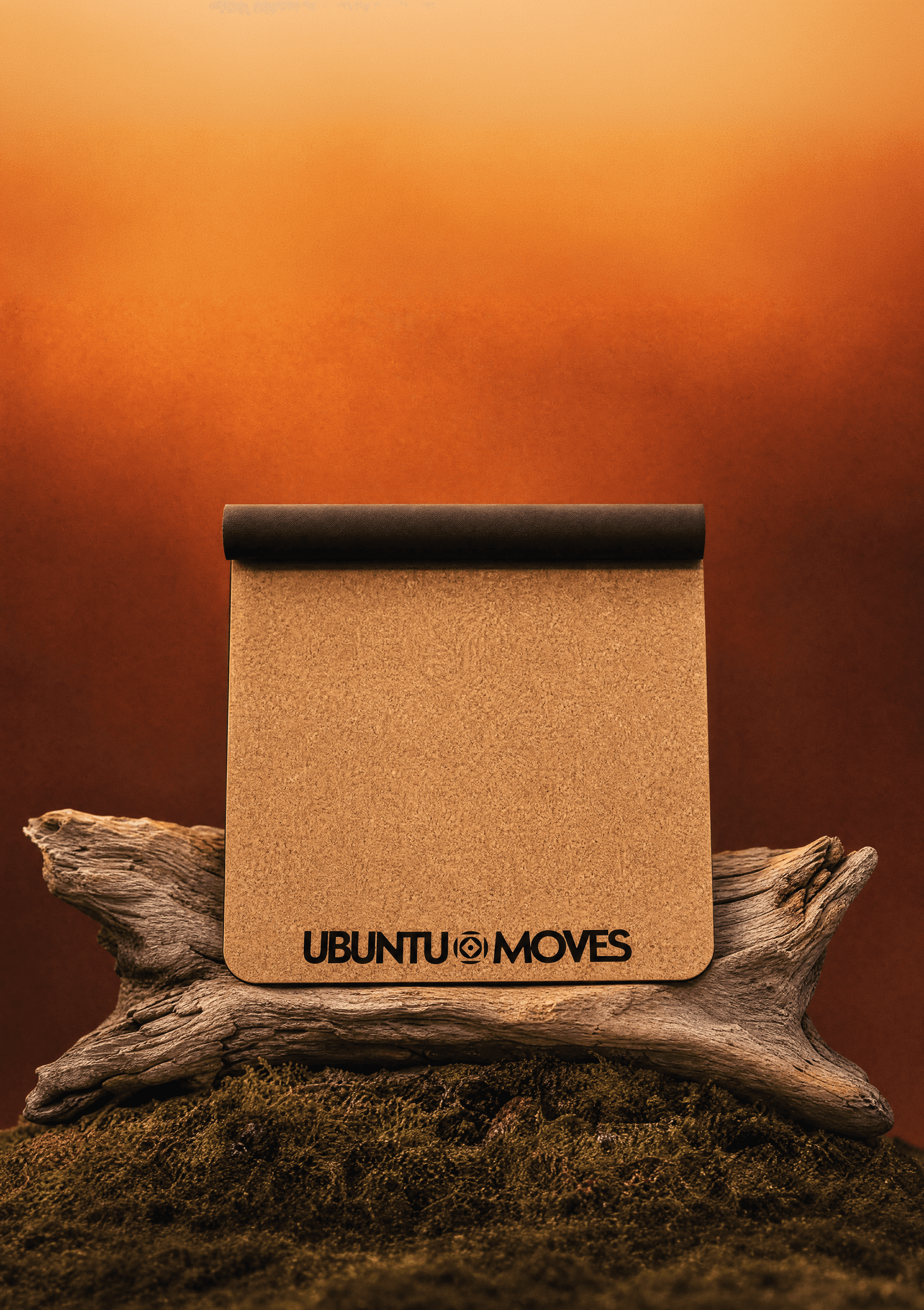Ubuntu Moves cork yoga mat on a log with a warm, hazy background.