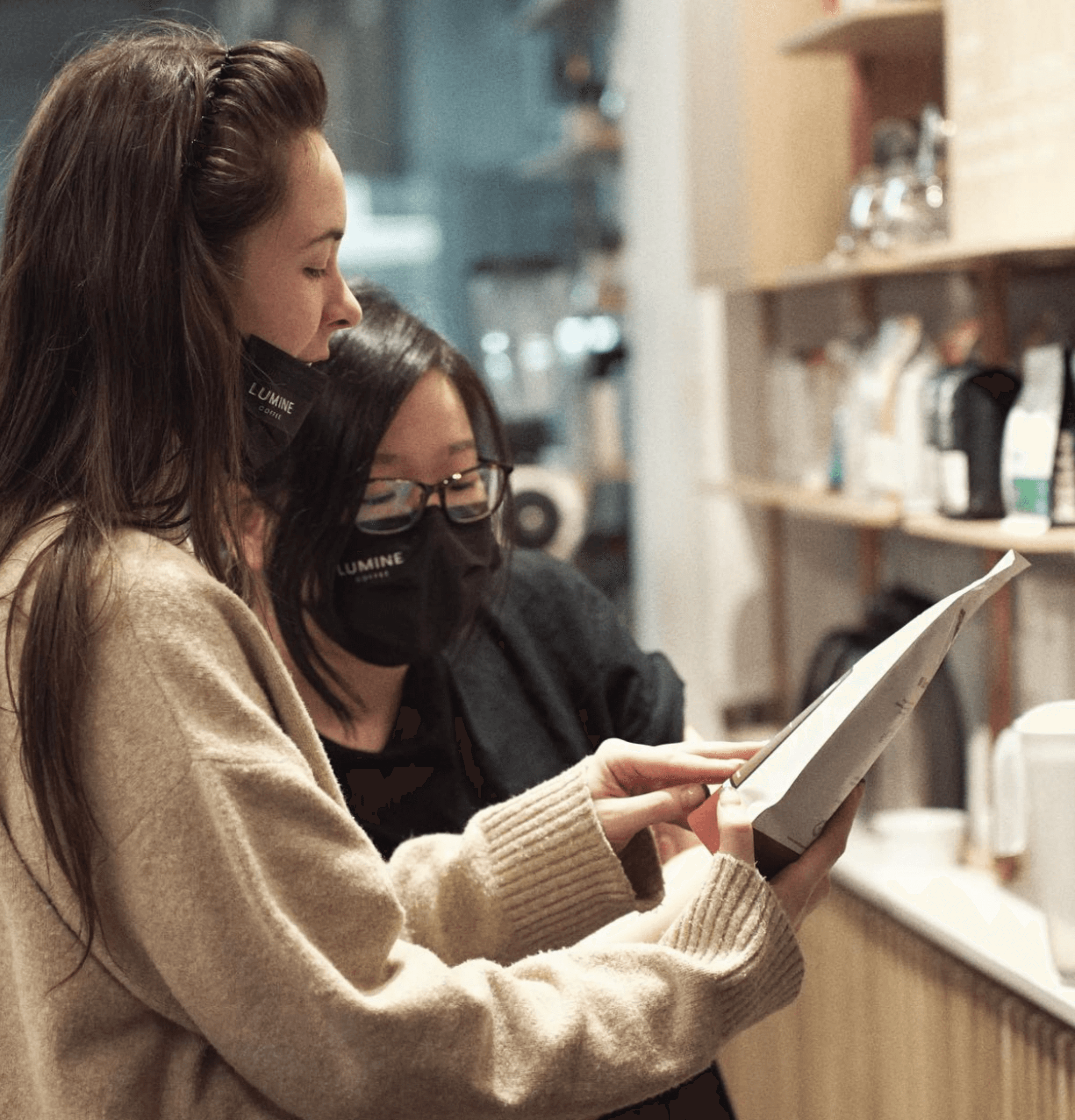 A group of three confident real estate professionals in formal business attire standing with arms crossed, representing Vistaires’ team