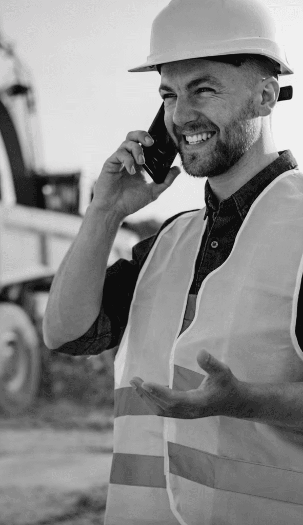 man in blue jacket wearing orange helmet