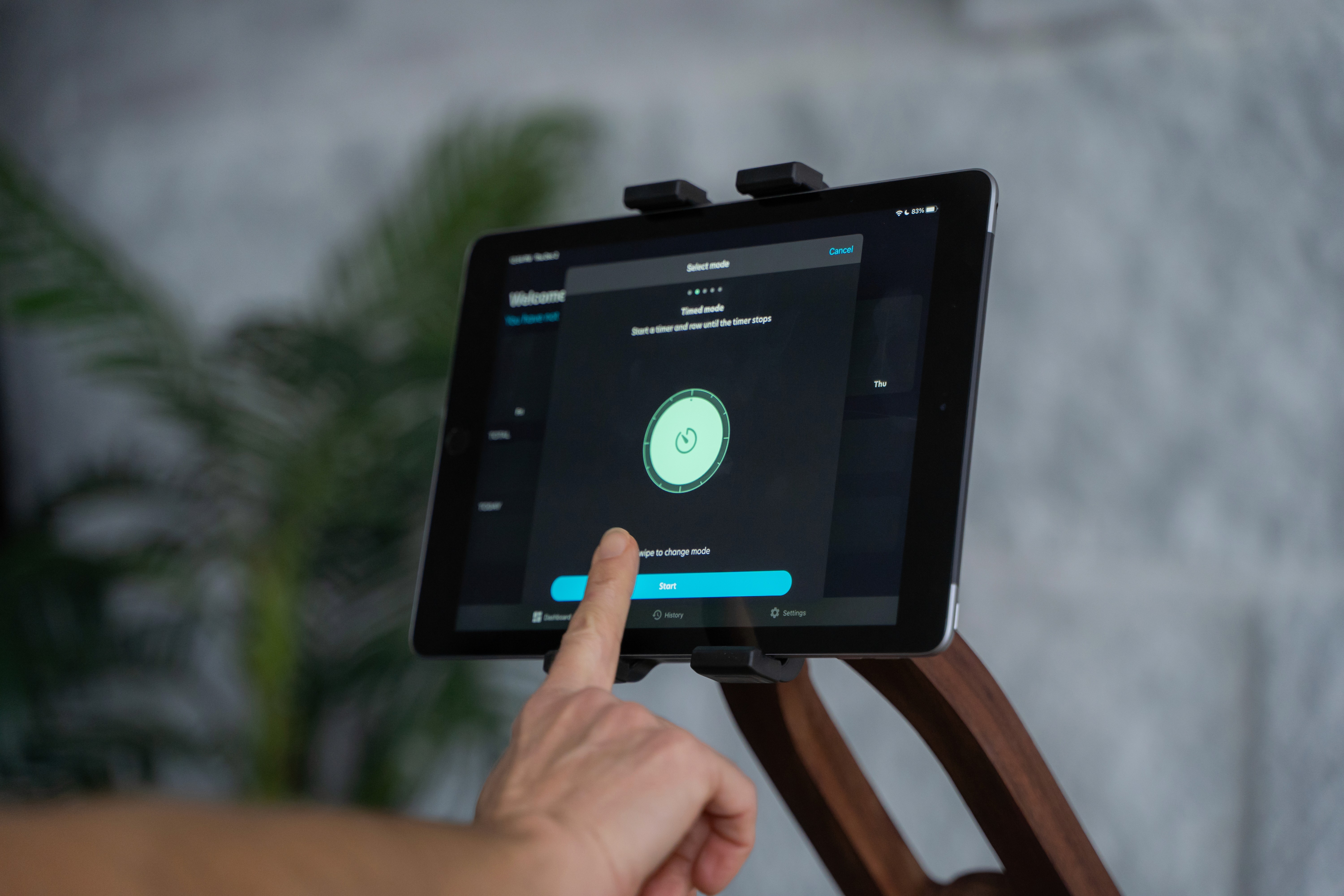 A screen mounted on a rowing machine that displays data from the workout