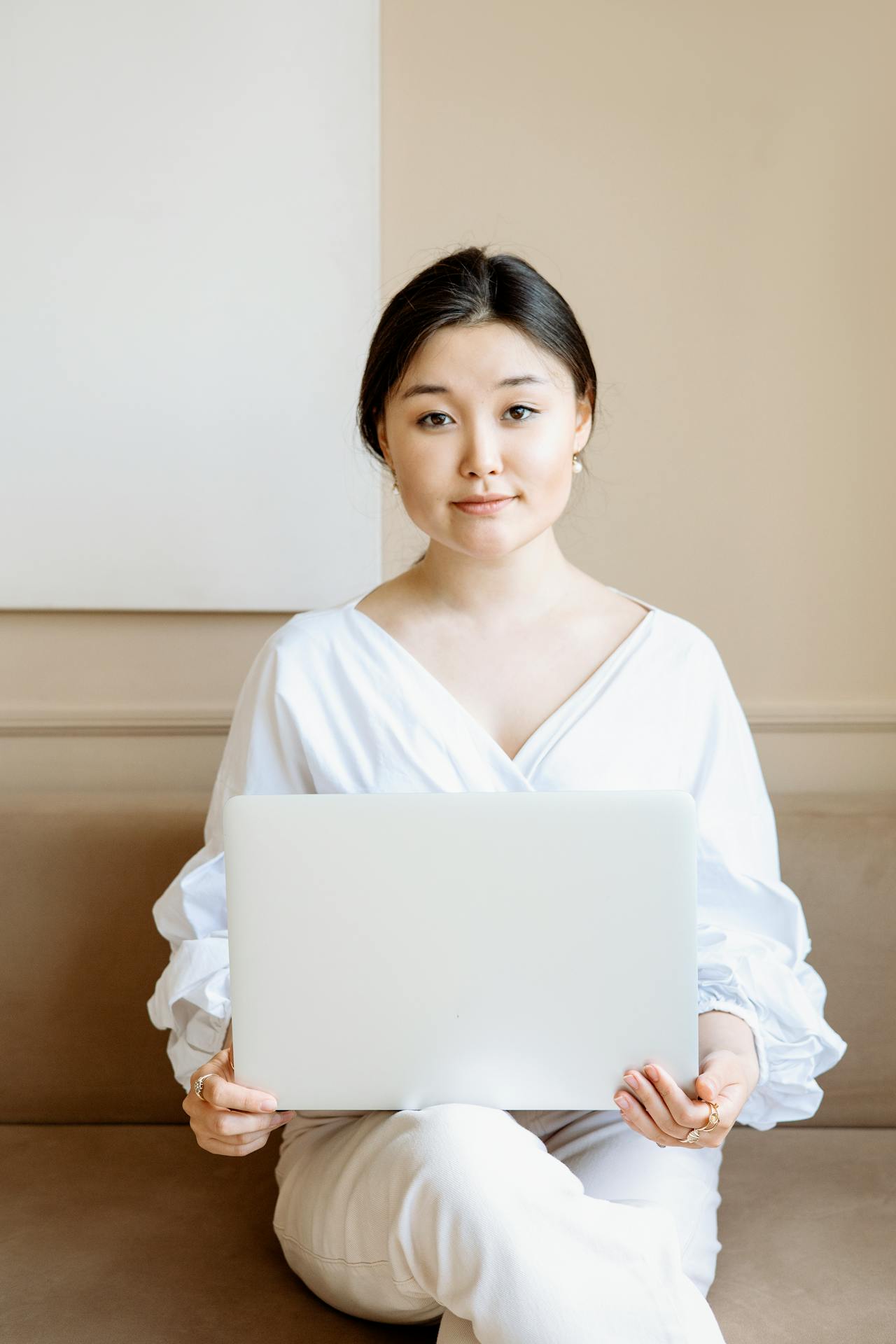 A Businesswoman Holding a Laptop