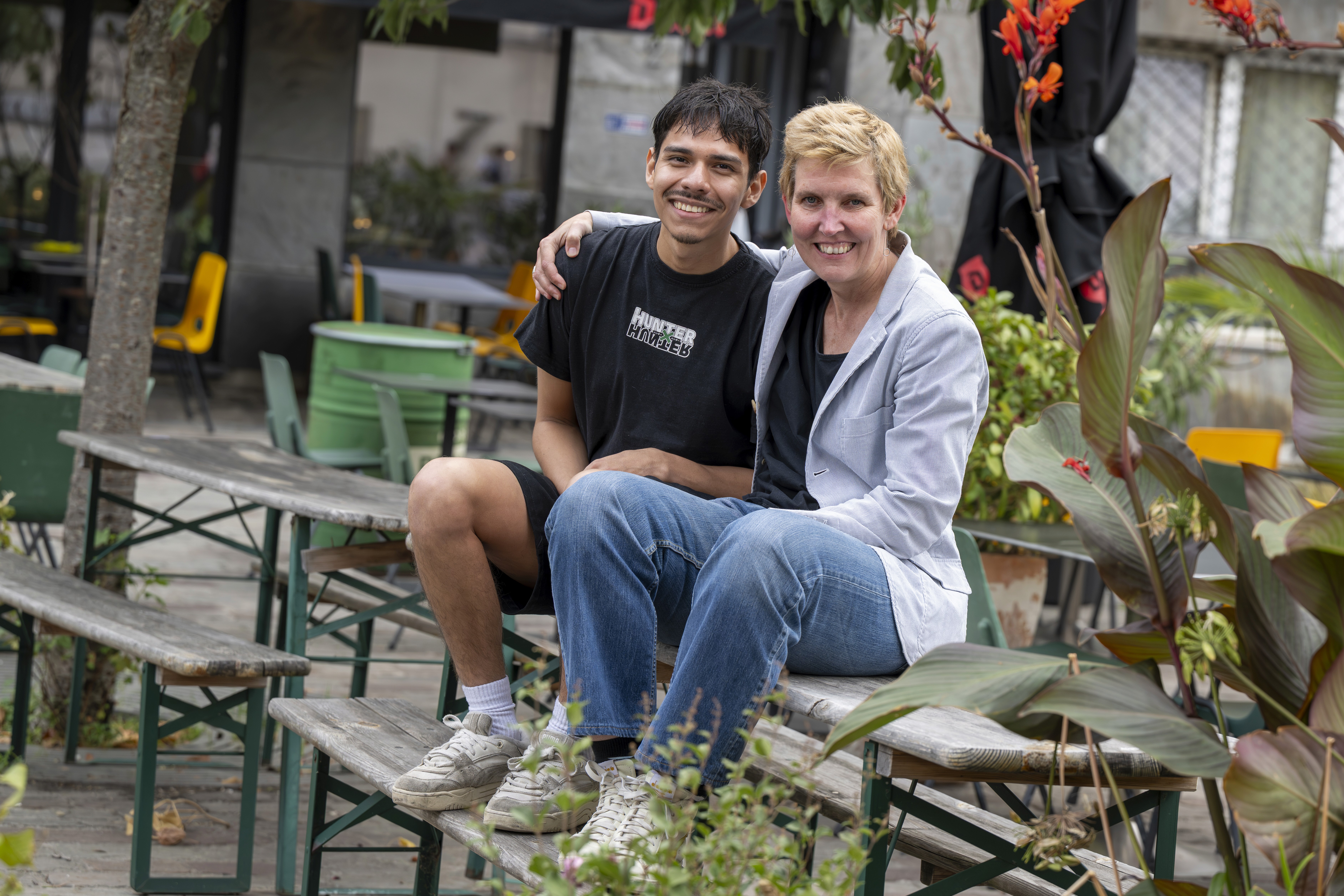 people holding miniature figures