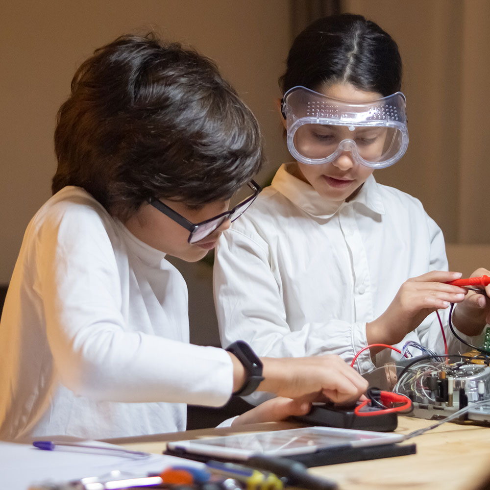 Students exploring science, technology, engineering, arts and math in hands-on STEAM after school program