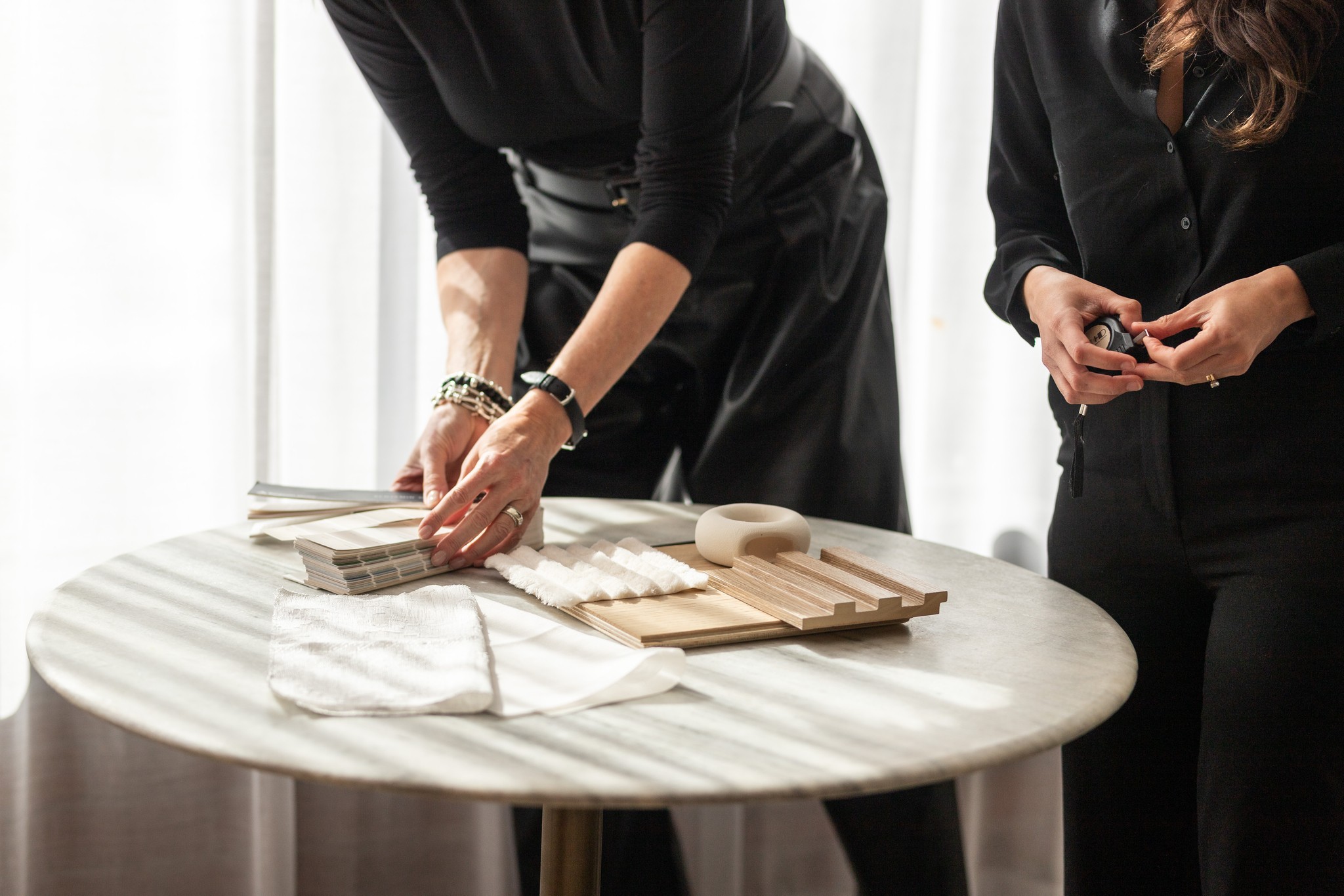 Image of KHD Homes designer selecting materials for home renovations and interior design with layout design and construction.