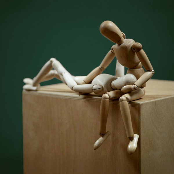 Sinnbild Systemische Beratung - zwei Holzfiguren