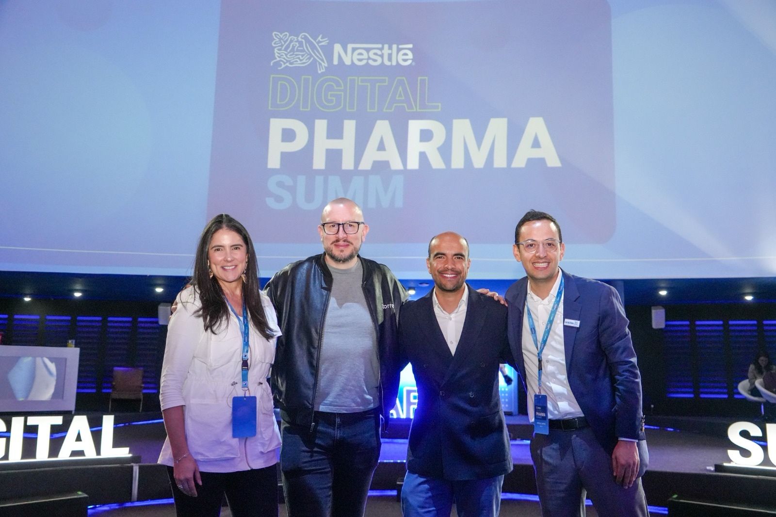 two people looking at a tablet and smiling