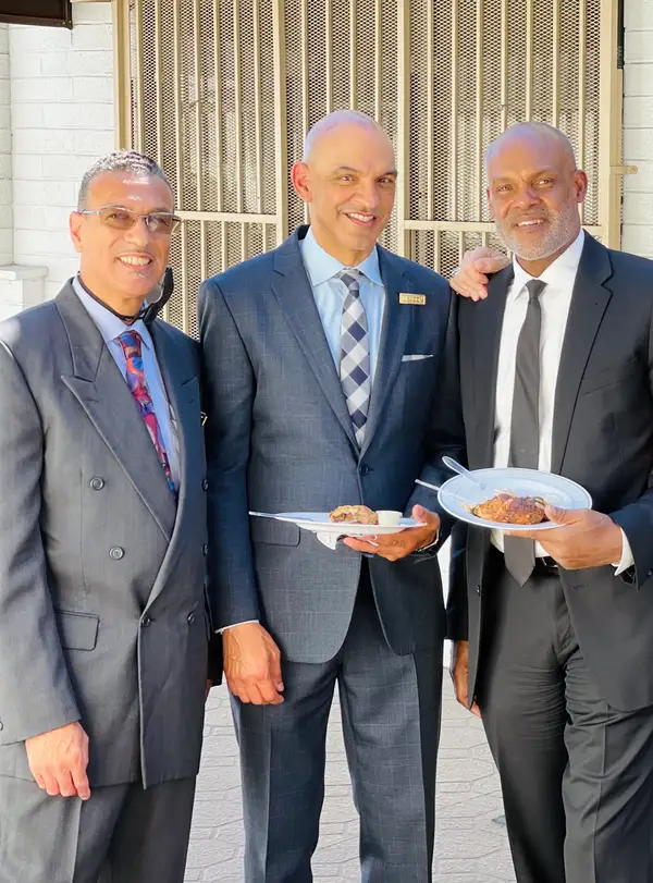 Church leaders gathering together after service at Peace Apostolic Church