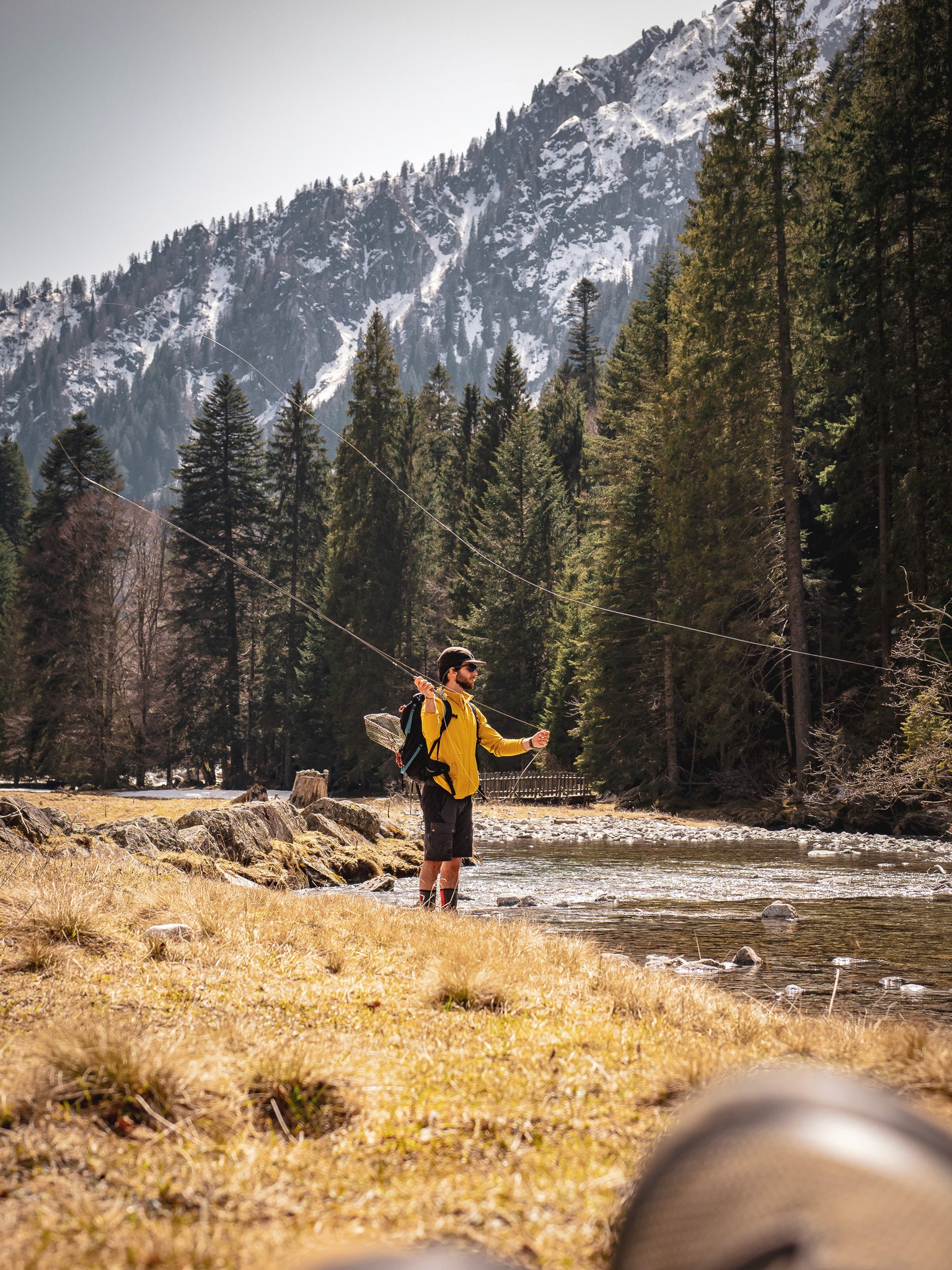 Combining trekking and fly fishing in the Dolomites, with traditional mountain huts dotting the picturesque trails