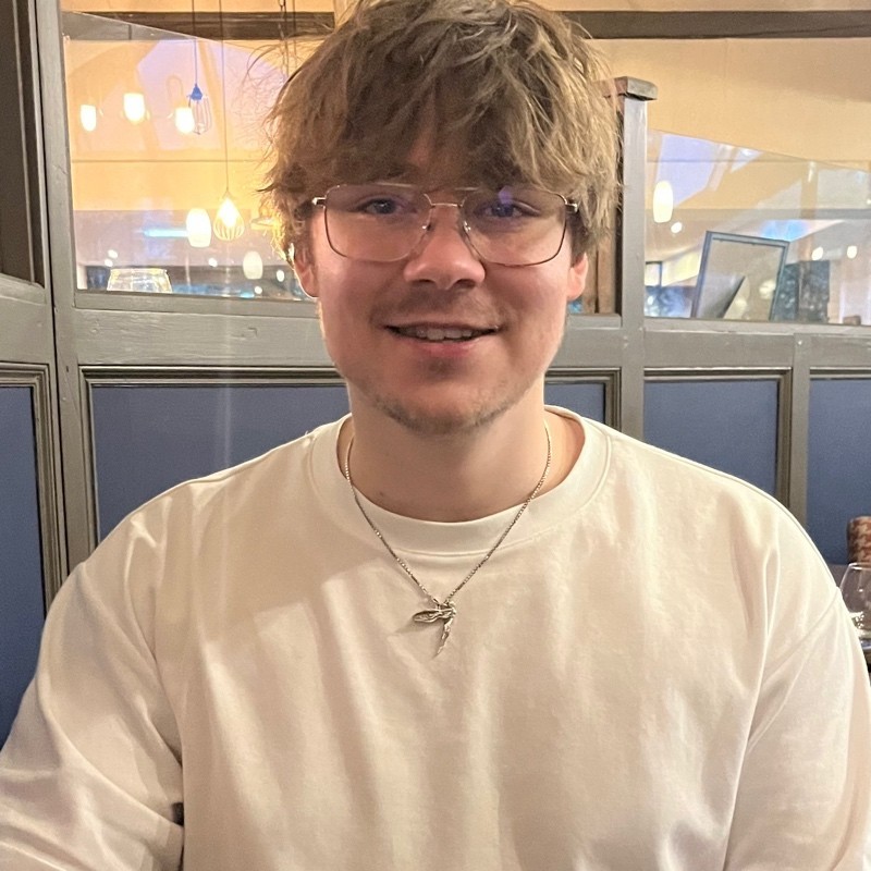 Headshot of Josh Bridges smiling at the camera.