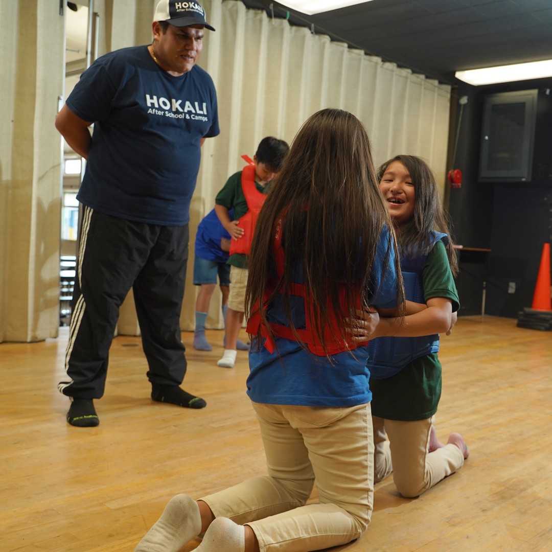 Kids learning discipline and self-defense in elementary school karate enrichment class