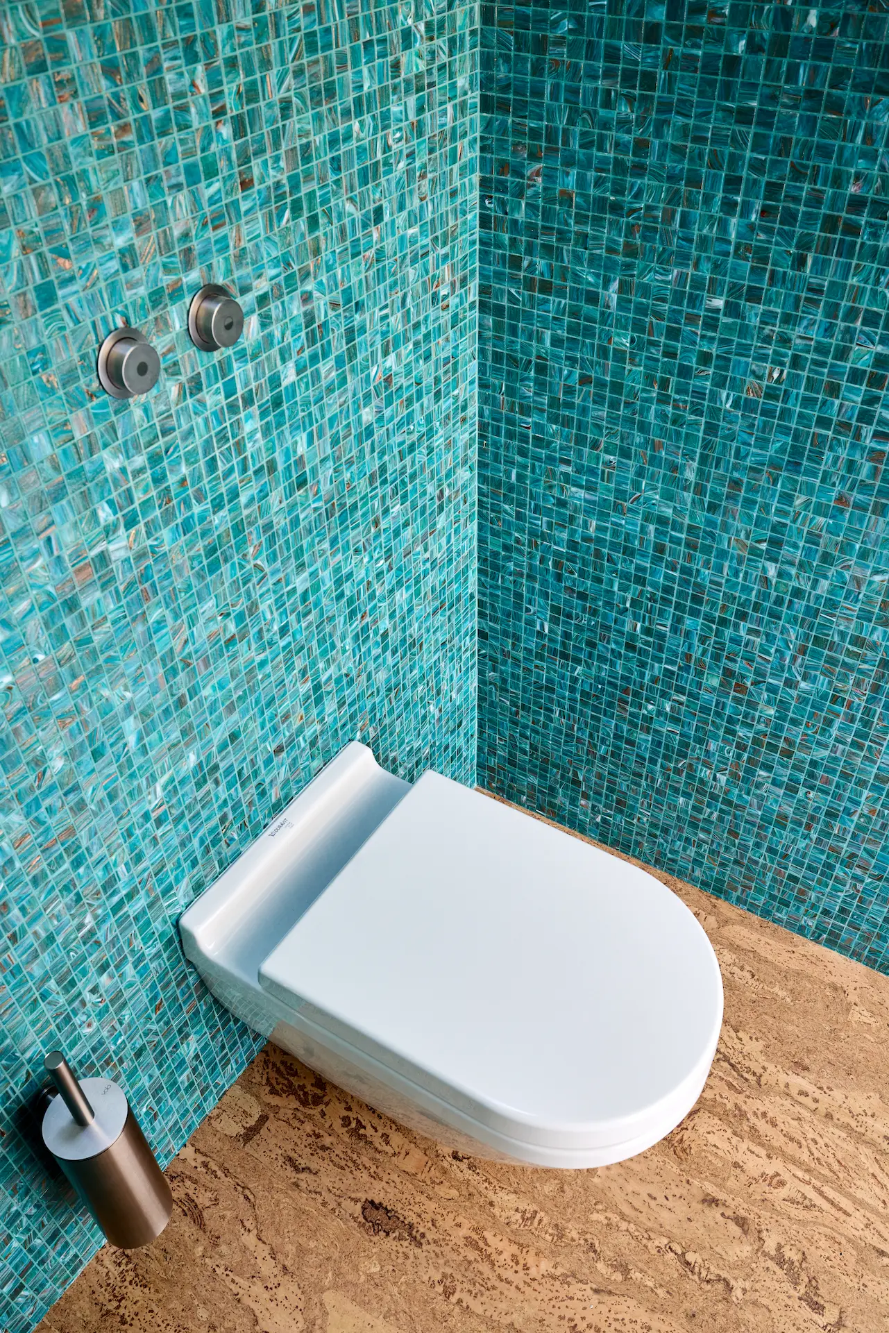 Portrait of the master bathroom's wall-mounted toilet, reflecting the modern updates made to this historically inspired Eichler home. Photo by Todd Huge.